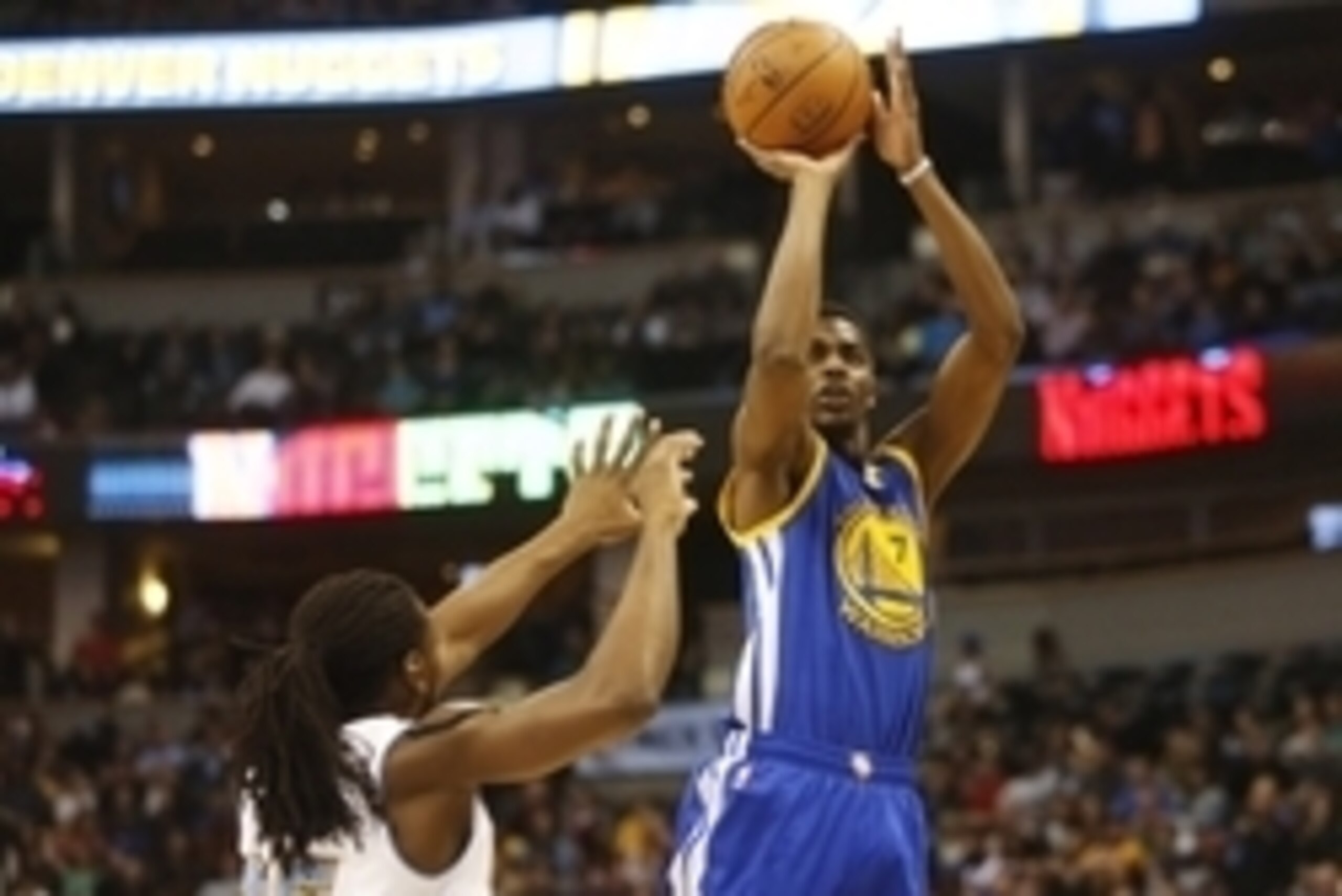 Mar 13, 2015; Denver, CO, USA; Golden State Warriors Golden State Warriors guard Justin Holiday (7) shoots the ball over Denver Nuggets forward Kenneth Faried (35) during the second half at Pepsi Center. The Nuggets won 114-103. Mandatory Credit: Chris Hu