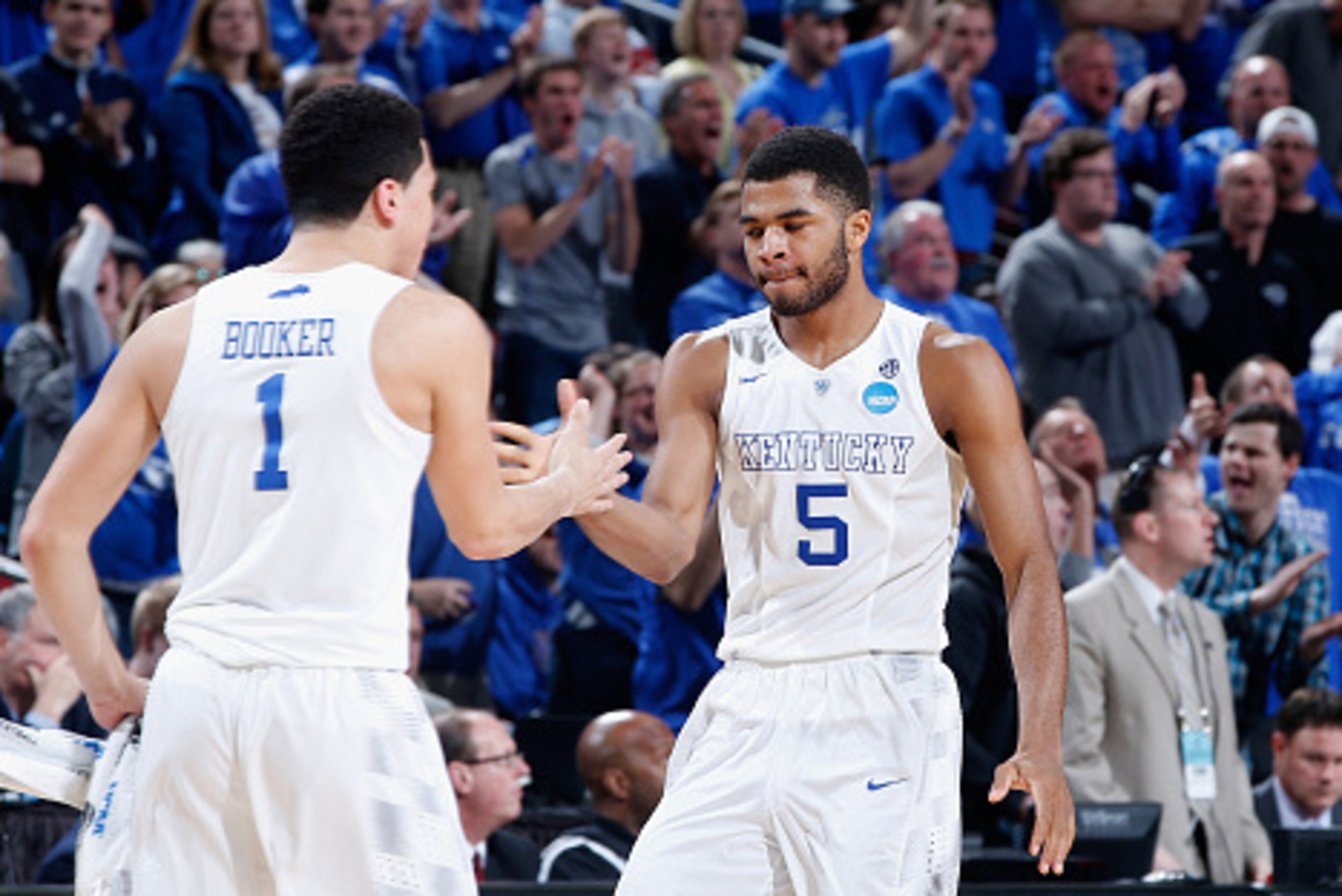 LOUISVILLE, KY - MARCH 21: Teammates Devin Booker #1 and Andrew Harrison #5 of the Kentucky Wildcats react against the Cincinnati Bearcats during the third round of the 2015 NCAA Men's Basketball Tournament at KFC YUM! Center on March 21, 2015 in Louisvi LOUISVILLE, KY - MARCH 21: Teammates Devin Booker #1 and Andrew Harrison #5 of the Kentucky Wildcats react against the Cincinnati Bearcats during the third round of the 2015 NCAA Men's Basketball Tournament at KFC YUM! Center on March 21, 2015 in Louisvi