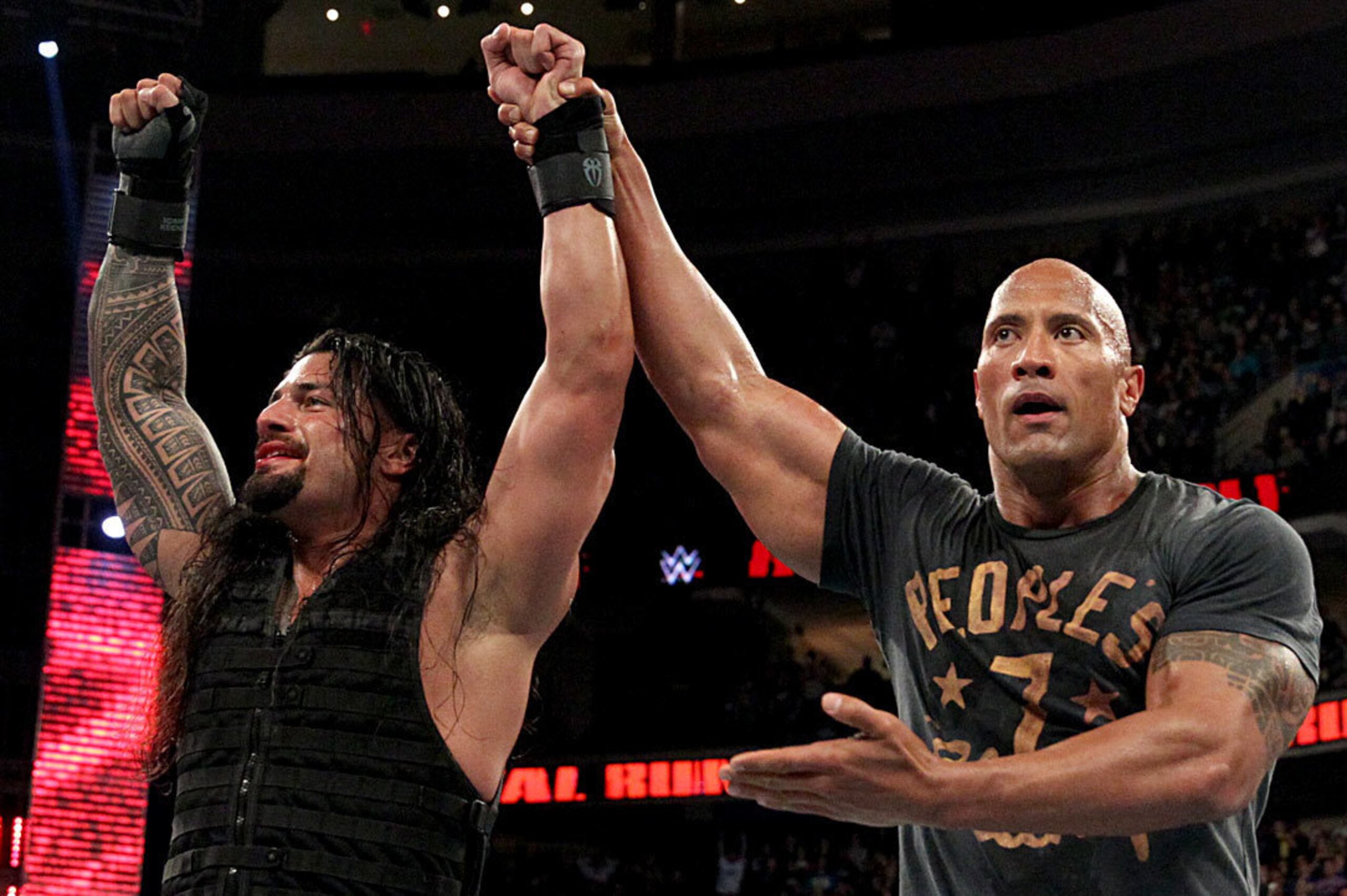 The Rock congratulates Roman Reigns on his Royal Rumble win.