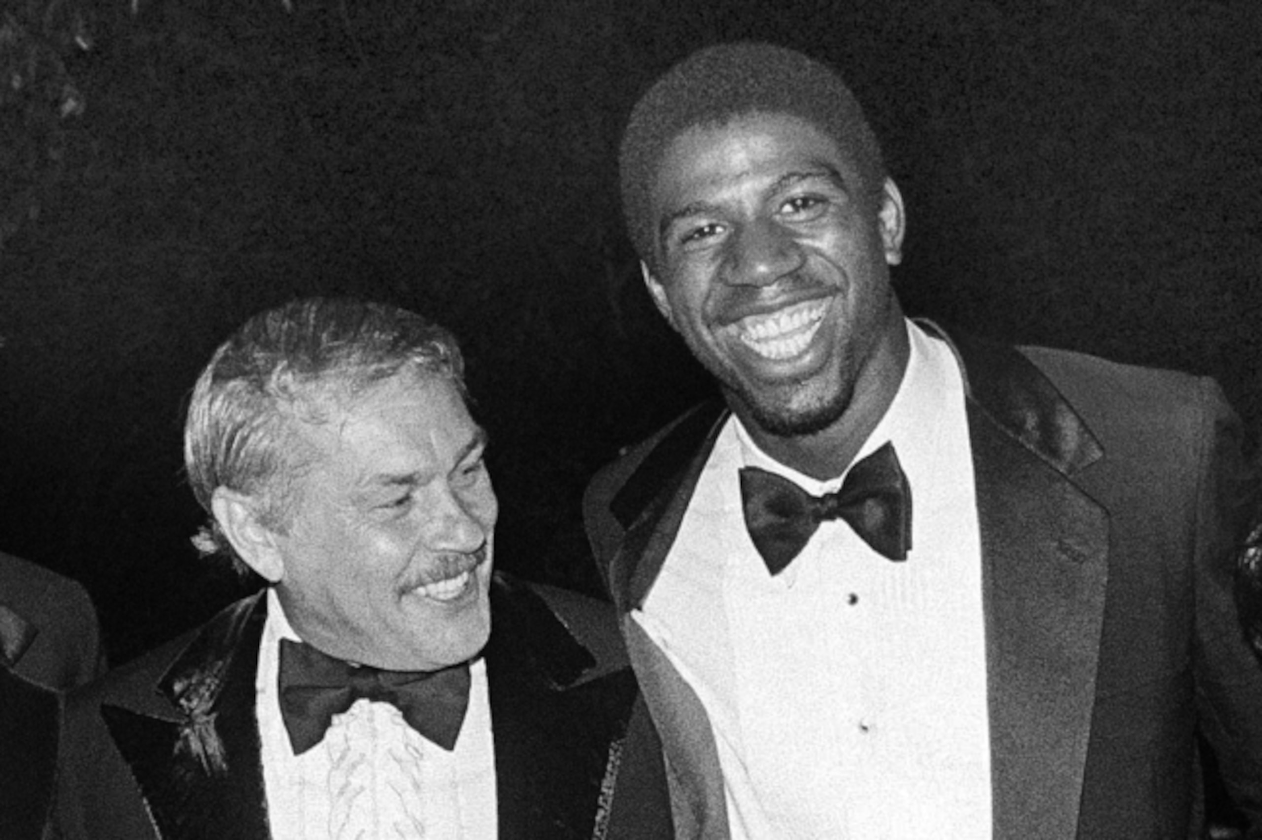 Jerry Buss celebrates the 1981 NBA title with the modern face of his franchise in 1981.