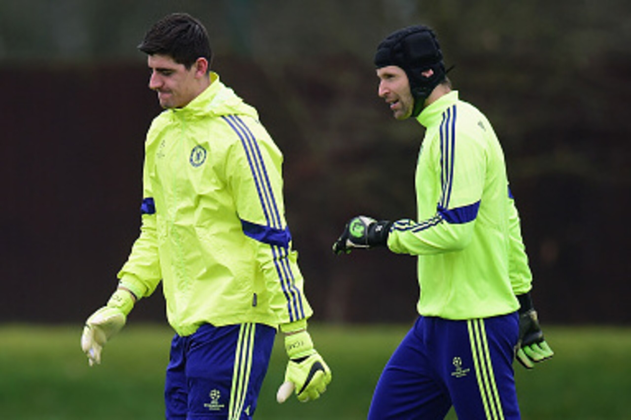 LONDON, ENGLAND - FEBRUARY 16:  Thibaut Courtois and Petr Cech of Chelsea talk during a Chelsea training session ahead of the UEFA Champions League round of 16 match against Paris Saint-Germain at Cobham Training Centre on February 16, 2015 in London, Uni