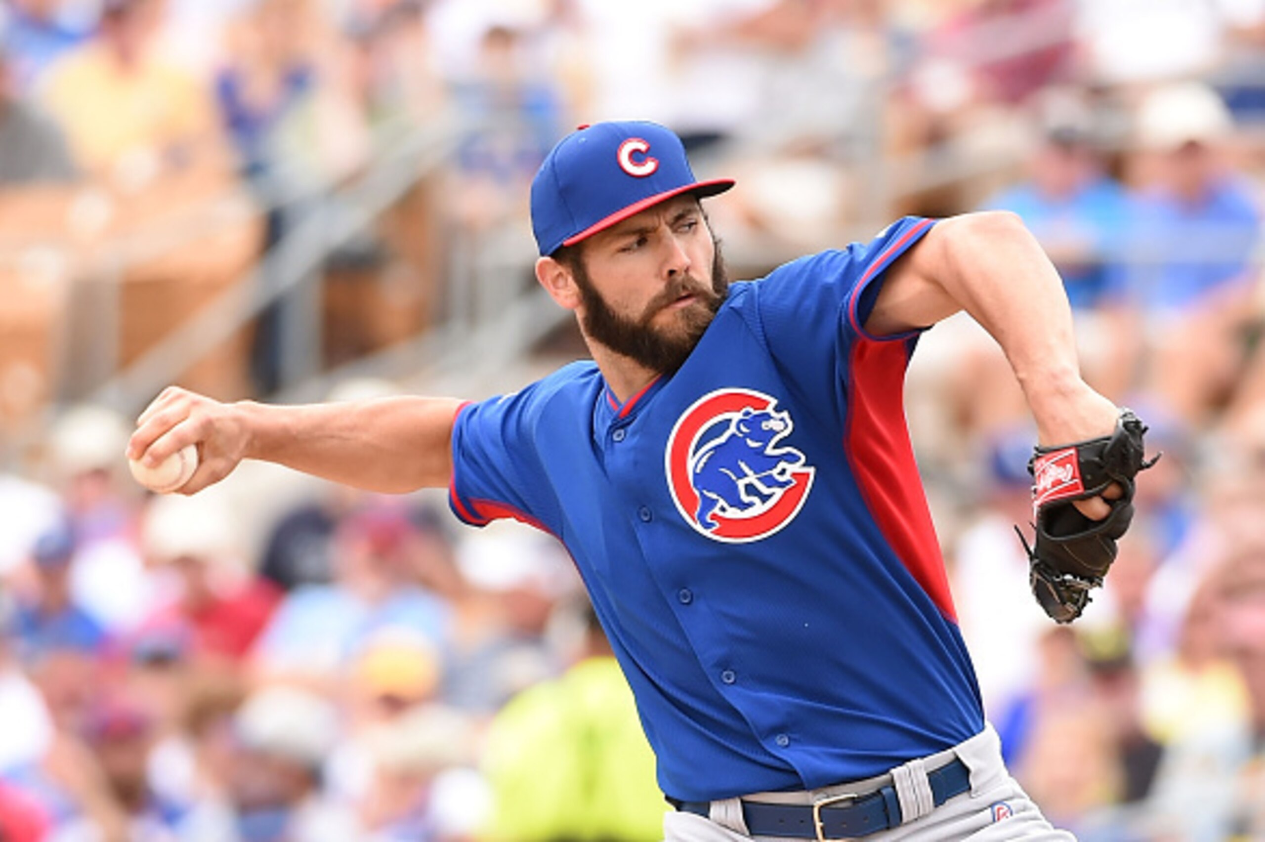 GLENDALE, AZ - MARCH 18:  Jake Arrieta #49 of the Chicago Cubs delivers a first inning pitch against the Los Angeles Dodgers at Camelback Ranch on March 18, 2015 in Glendale, Arizona.  (Photo by Norm Hall/Getty Images)