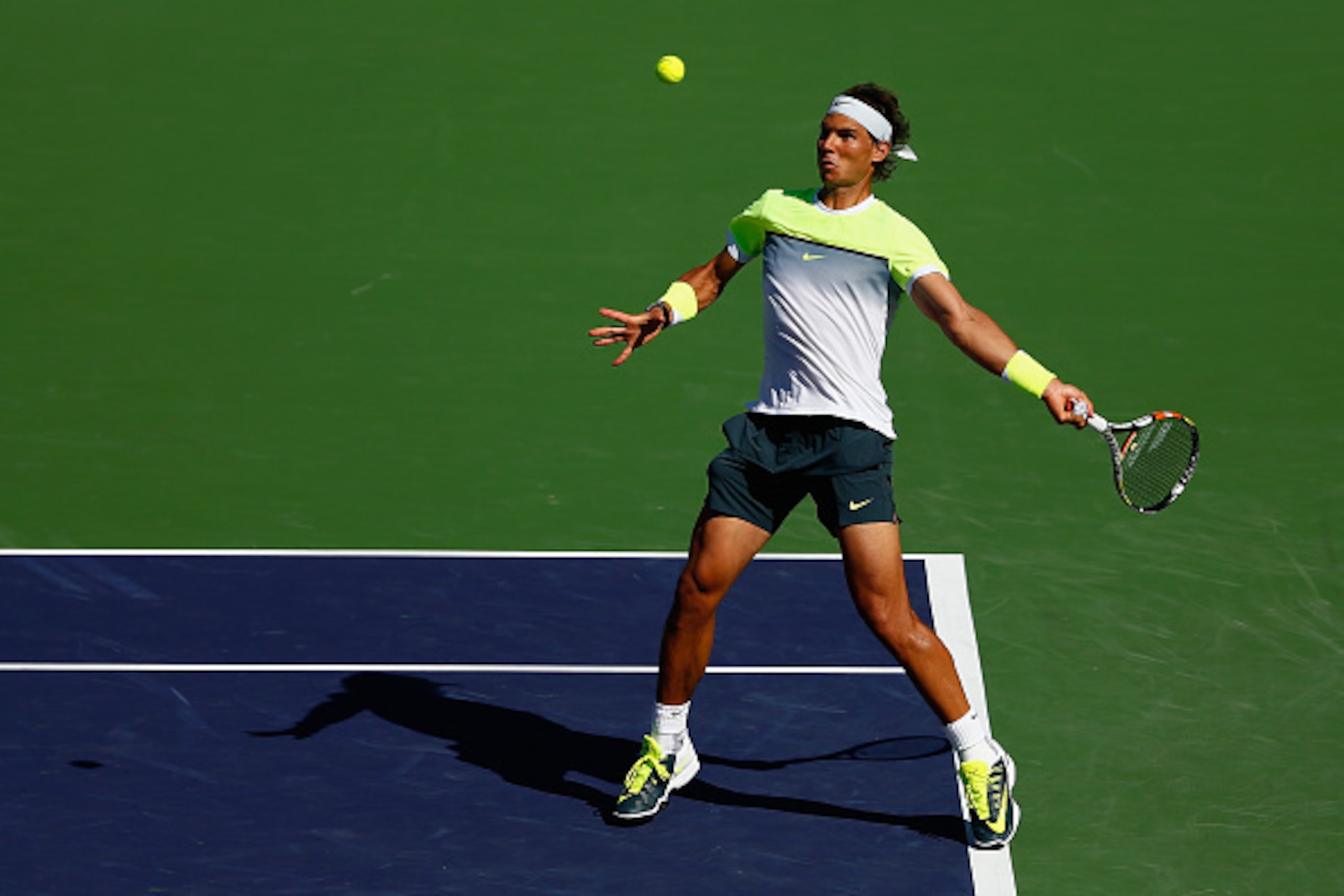 INDIAN WELLS, CA - MARCH 20:  Rafael Nadal of Spain plays a forehand in his match against Milos Raonic of Canada during day twelve of the BNP Paribas Open tennis at the Indian Wells Tennis Garden on March 20, 2015 in Indian Wells, California.  (Photo by J