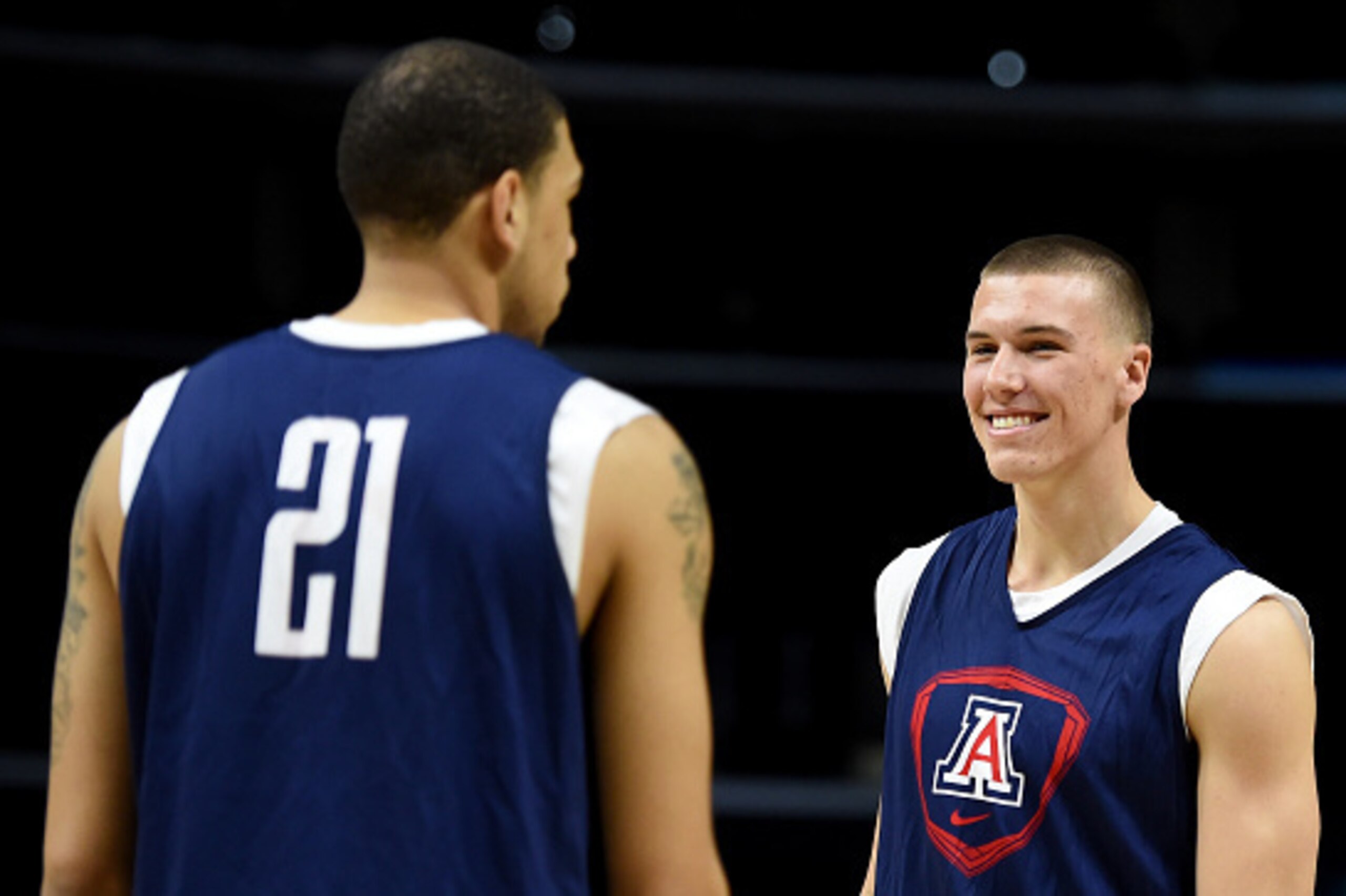 LOS ANGELES, CA - MARCH 25:  Kaleb Tarczewski #35 of the Arizona Wildcats smiles at Brandon Ashley #21 during practice at Staples Center on March 25, 2015 in Los Angeles, California.  (Photo by Harry How/Getty Images)