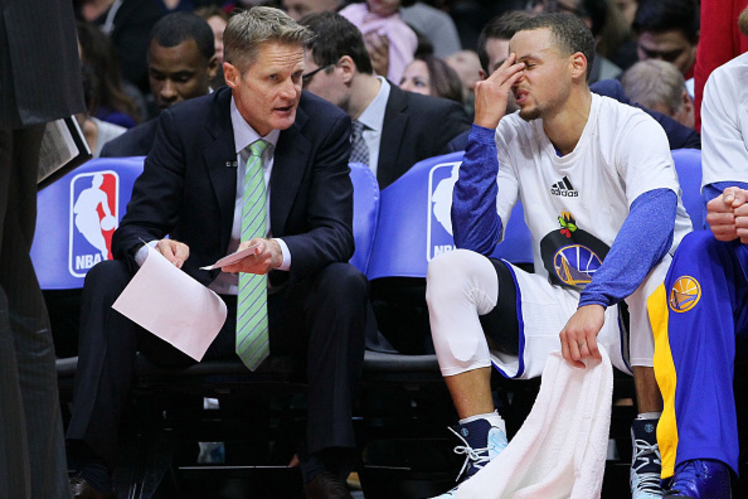LOS ANGELES, CA - DECEMBER 25:   Head Coach Steve Kerr of the Golden State Warriors has a word with Stephen Curry #30 on the bench during the second half of their NBA game against the Los Angeles Clippers at Staples Center on December 25, 2014 in Los Ange
