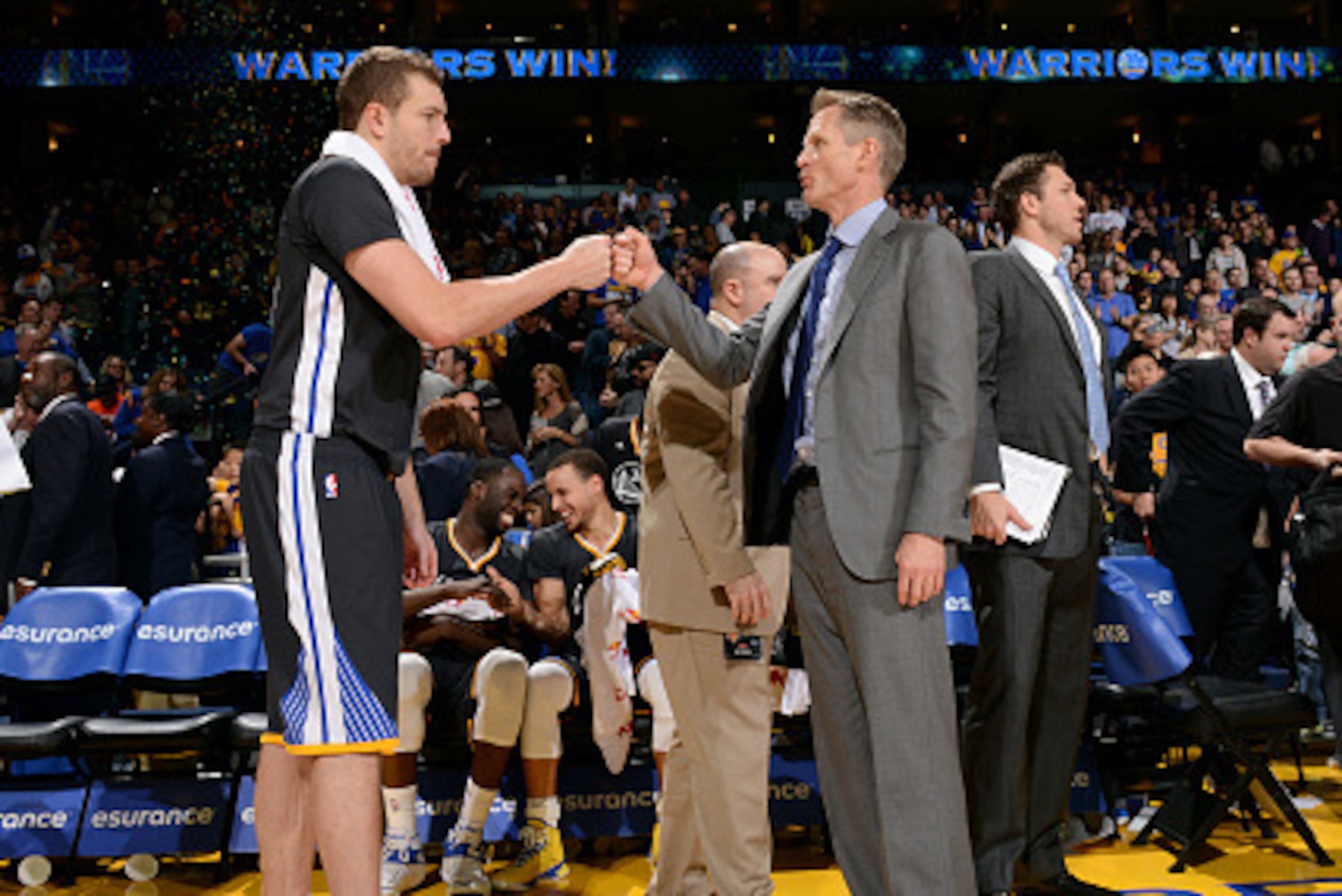 OAKLAND, CA - JANUARY 31: David Lee #10 and head coach Steve Kerr of the Golden State Warriors celebrate during a game against the Phoenix Suns on January 31, 2015 at Oracle Arena in Oakland, California. NOTE TO USER: User expressly acknowledges and agree
