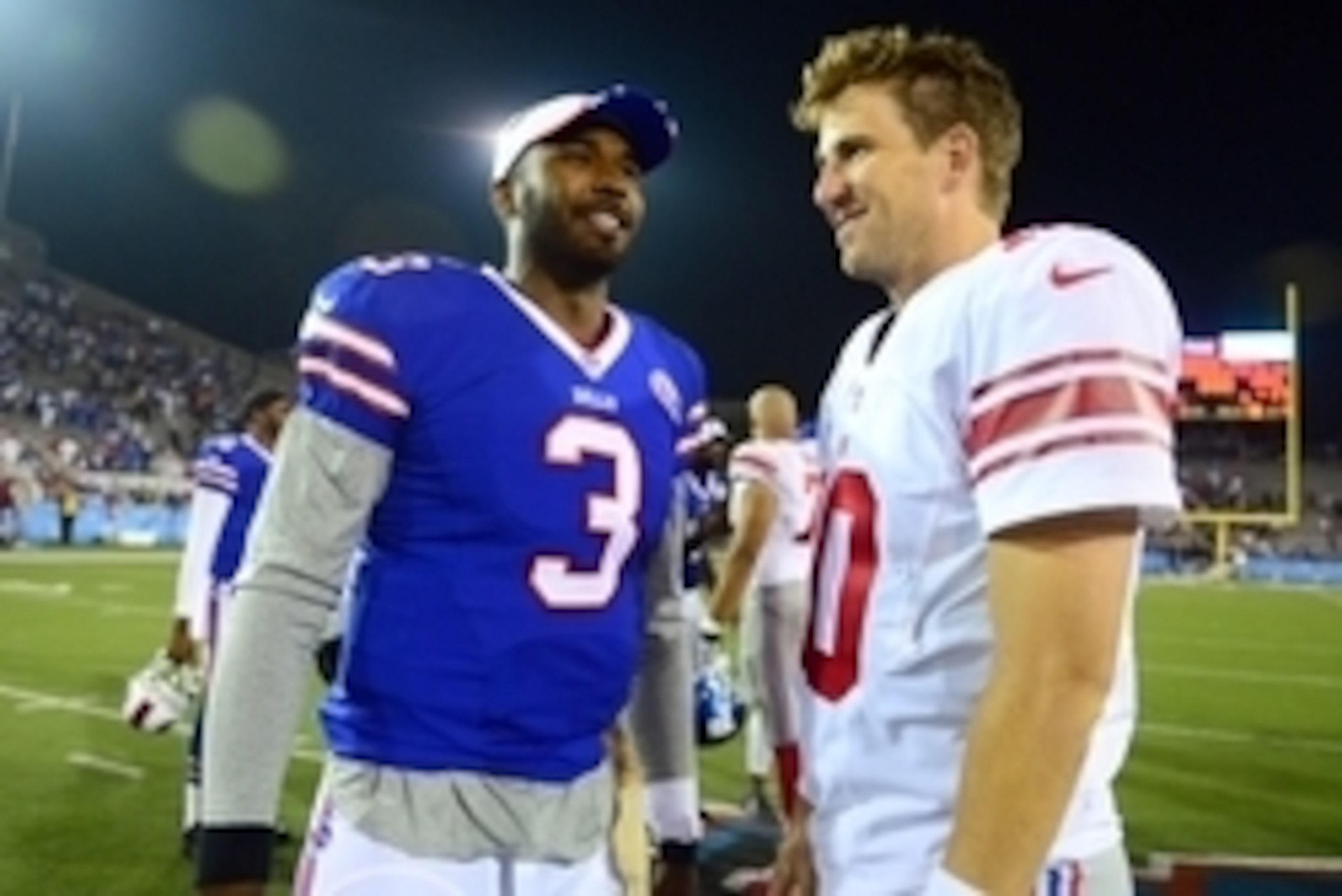 Aug 3, 2014; Canton, OH, USA; Buffalo Bills quarterback EJ Manuel (3) talks with New York Giants quarterback Eli Manning (10) after the 2014 Pro Football Hall of Fame game at Fawcett Stadium. Mandatory Credit: Andrew Weber-USA TODAY Sports