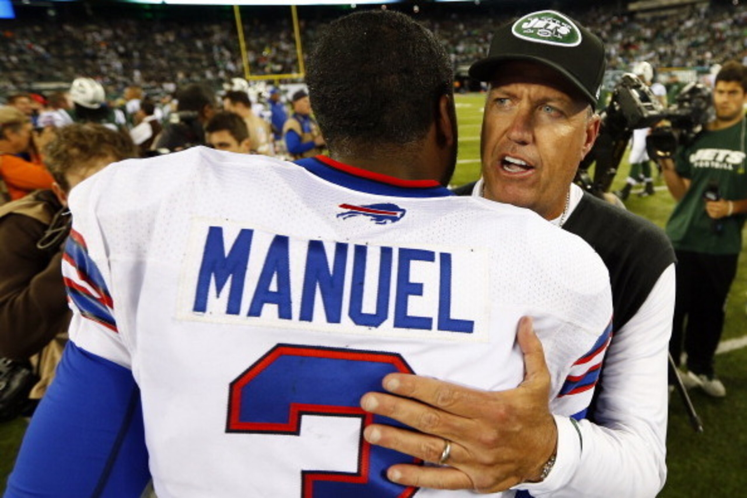EAST RUTHERFORD, NJ - SEPTEMBER 22: Quarterback EJ Manuel #3 of the Buffalo Bills and head coach Rex Ryan of the New York Jets meet on the field after the Jets defeated the Bills 27-20 at MetLife Stadium on September 22, 2013 in East Rutherford, New Jerse