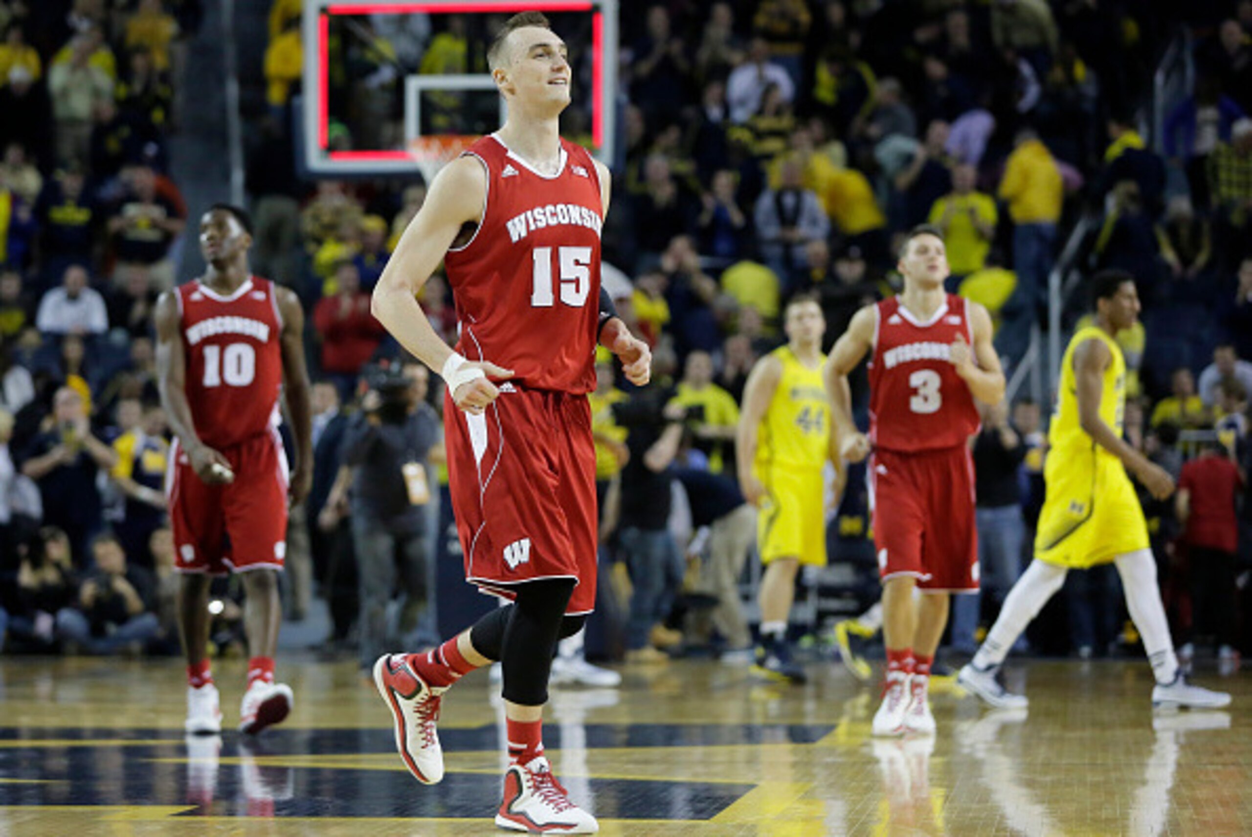 ANN ARBOR, MI - JANUARY 24:  Sam Dekker #15 of the Wisconsin Badgers smiles as he leaves the court following a 69-64 overtime win over the Michigan Wolverones at Crisler Arena on January 24, 2015 in Ann Arbor, Michigan. Dekker scored 15 points in the game