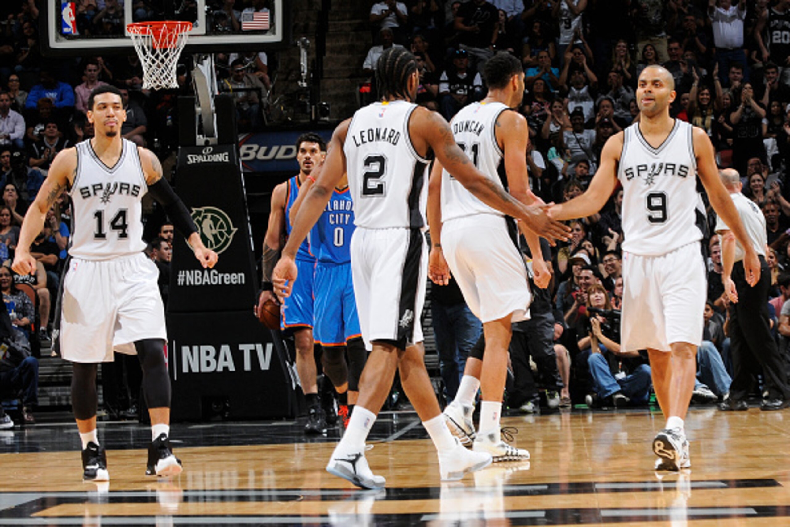 SAN ANTONIO - MARCH 25: Kawhi Leonard #2 and Tony Parker #9 of the San Antonio Spurs during the game against the Oklahoma City Thunder at the AT&T Center on March 25, 2014 in San Antonio, Texas. NOTE TO USER: User expressly acknowledges and agrees that, b SAN ANTONIO - MARCH 25: Kawhi Leonard #2 and Tony Parker #9 of the San Antonio Spurs during the game against the Oklahoma City Thunder at the AT&T Center on March 25, 2014 in San Antonio, Texas. NOTE TO USER: User expressly acknowledges and agrees that, b