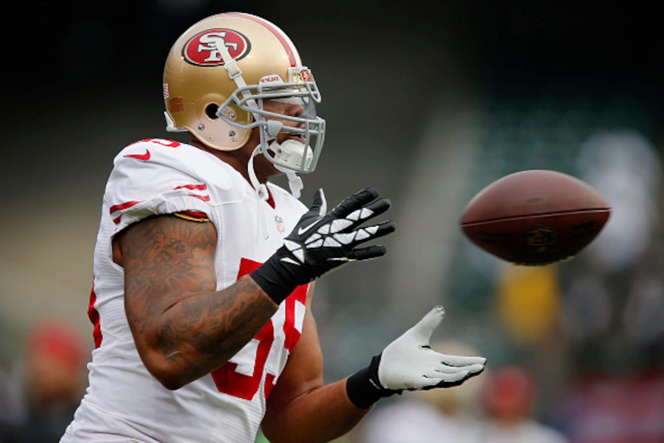 OAKLAND, CA - DECEMBER 7:  Linebacker Ahmad Brooks #55 of the San Francisco 49ers catches a pass against the Oakland Raiders on December 7, 2014 at O.co Coliseum in Oakland, California.  The Raiders won 24-13.  (Photo by Brian Bahr/Getty Images)