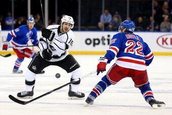 NEW YORK, NY - MARCH 24:  Mike Richards #10 of the Los Angeles Kings and Dan Boyle #22 of the New York Rangers fight for the loose puck n March 24, 2015 at Madison Square Garden in New York City.The Los Angeles Kings defeated the New York Rangers 4-2.  (P