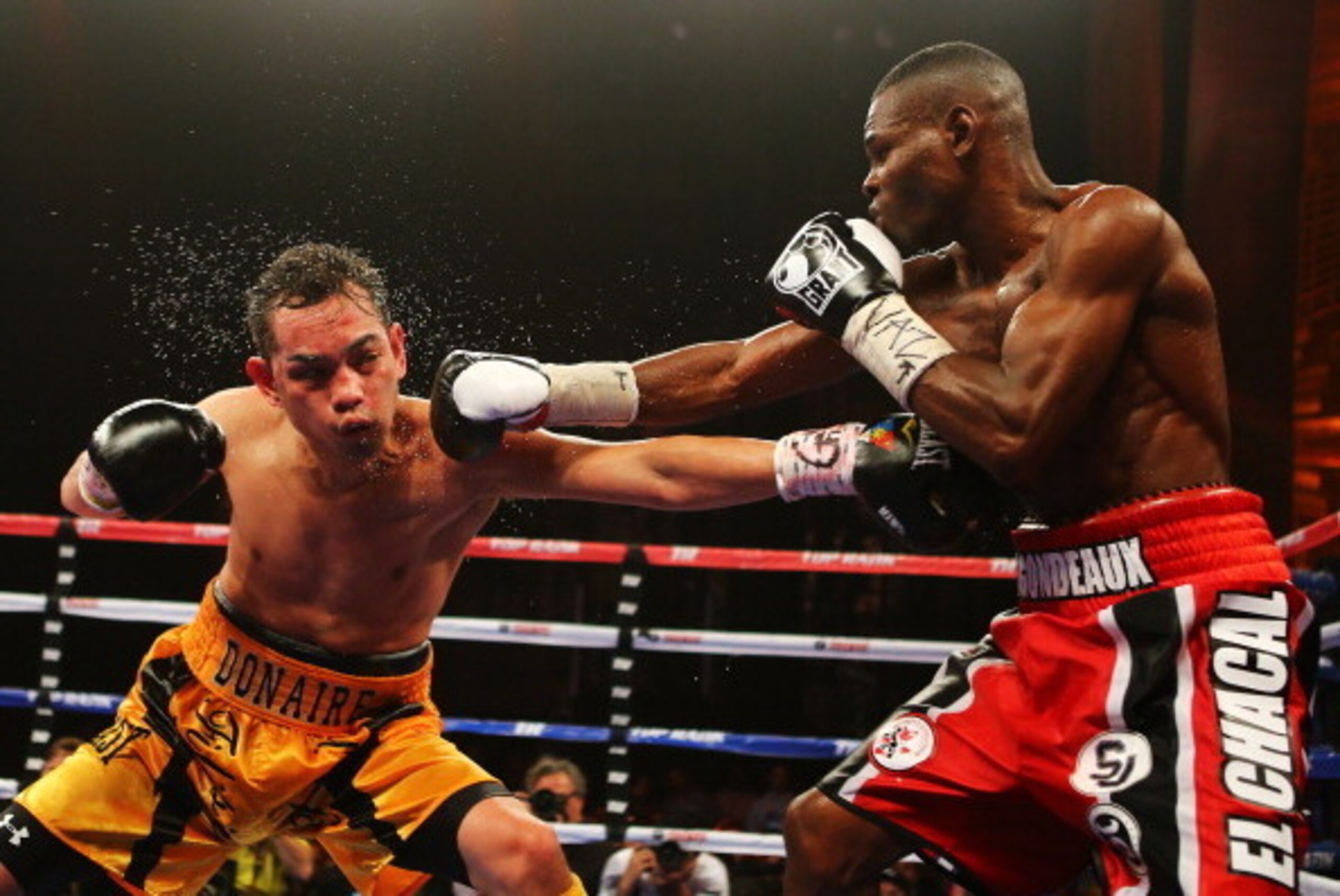 NEW YORK, NY - APRIL 13:  Guillermo Rigondeaux punches Nonito Donaire during their WBO/WBA junior featherweight title unification bout at Radio City Music Hall on April 13, 2013 in New York City.  (Photo by Al Bello/Getty Images)