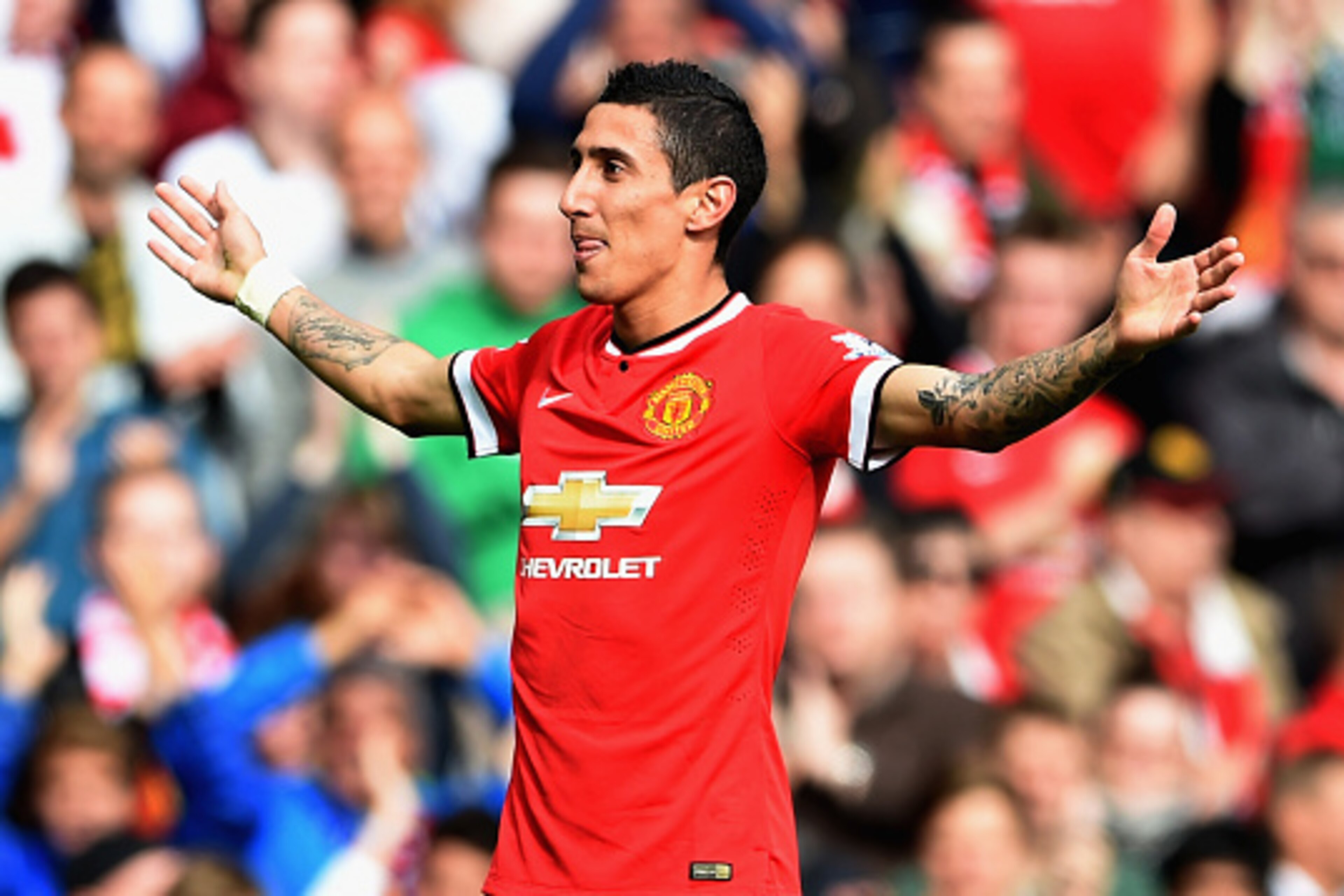 MANCHESTER, ENGLAND - OCTOBER 05:  Angel Di Maria of Manchester United celebrates scoring the first goal during the Barclays Premier League match between Manchester United and Everton at Old Trafford on October 5, 2014 in Manchester, England.  (Photo by M