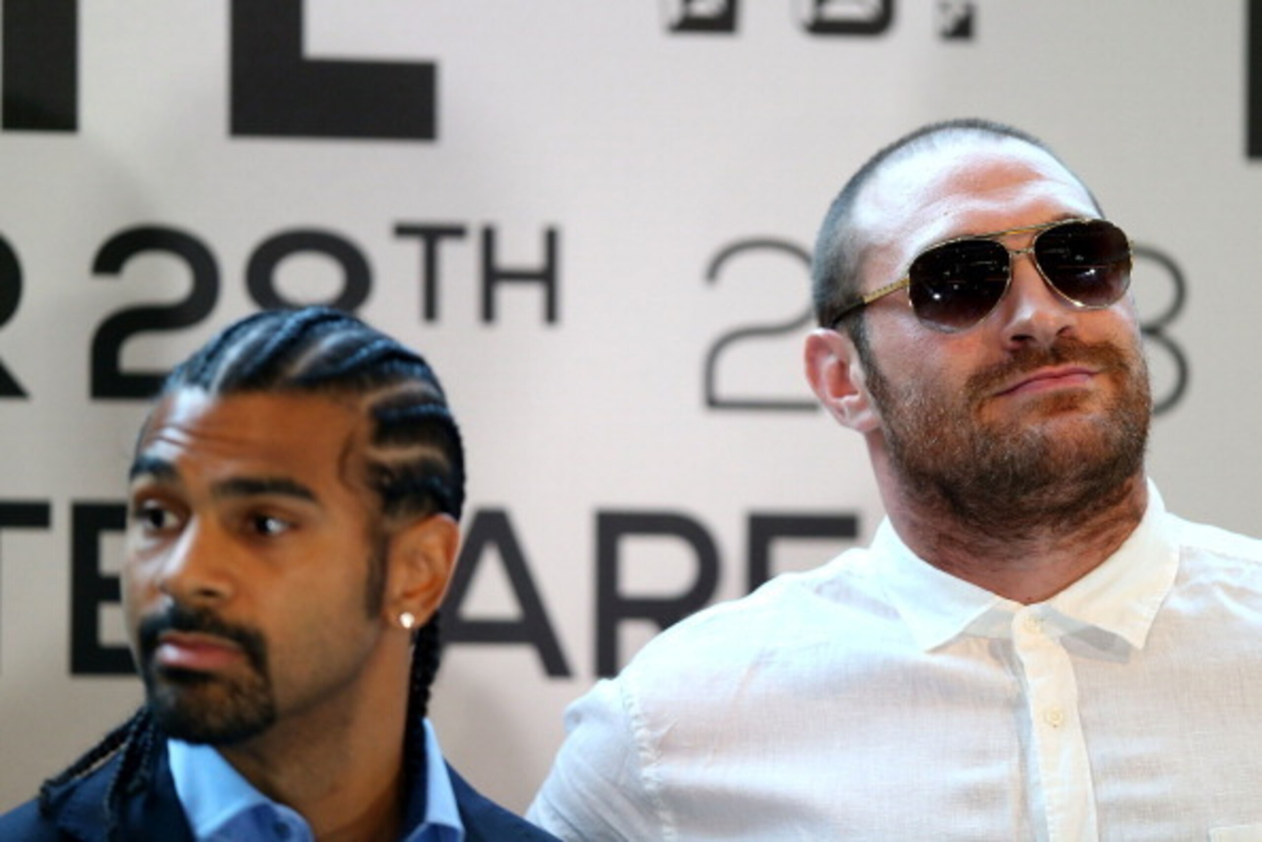 LONDON, ENGLAND - JULY 11:  British heavyweight boxers Tyson Fury (R) and David Haye attend a press conference to announce their upcoming title fight on July 11, 2013 in London, England.  (Photo by Clive Rose/Getty Images)