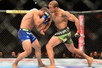 Oct 25, 2014; Rio de Janeiro, Brazil; Jose Aldo (red gloves) fights against Chad Mendez (blue gloves) during UFC 179 at Ginasio do Maracanazinho. Mandatory Credit: Jason Silva-USA TODAY Sports