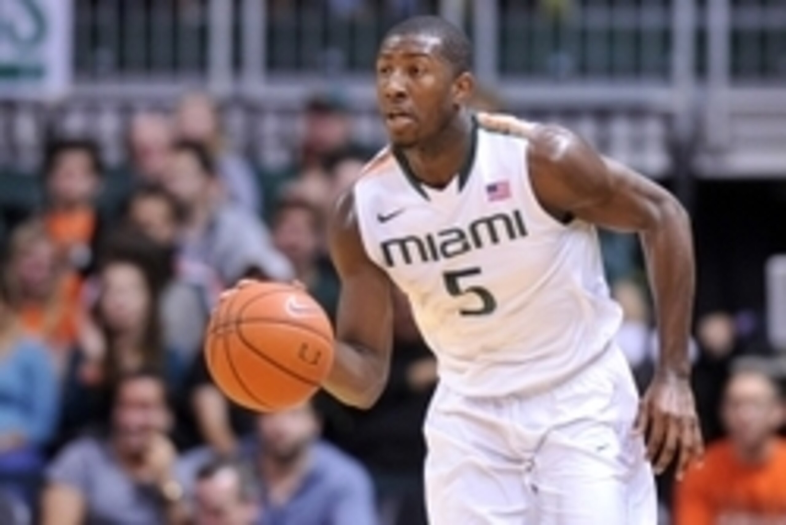 Jan 28, 2015; Coral Gables, FL, USA; Miami Hurricanes guard Davon Reed (5) dribbles the ball against the Georgia Tech Yellow Jackets during the second half at BankUnited Center. Mandatory Credit: Steve Mitchell-USA TODAY Sports