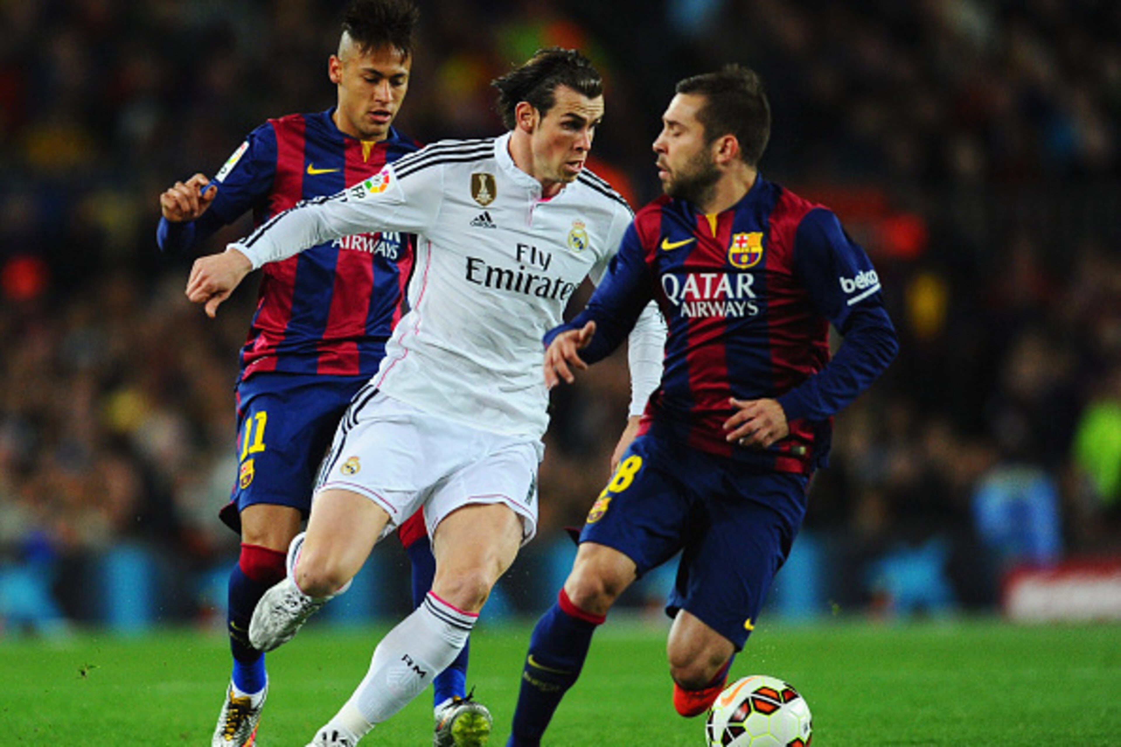 BARCELONA, SPAIN - MARCH 22:  Gareth Bale of Real Madrid CF takes on Neymar and Jordi Alba of Barcelona during the La Liga match between FC Barcelona and Real Madrid CF at Camp Nou on March 22, 2015 in Barcelona, Spain.  (Photo by David Ramos/Getty Images