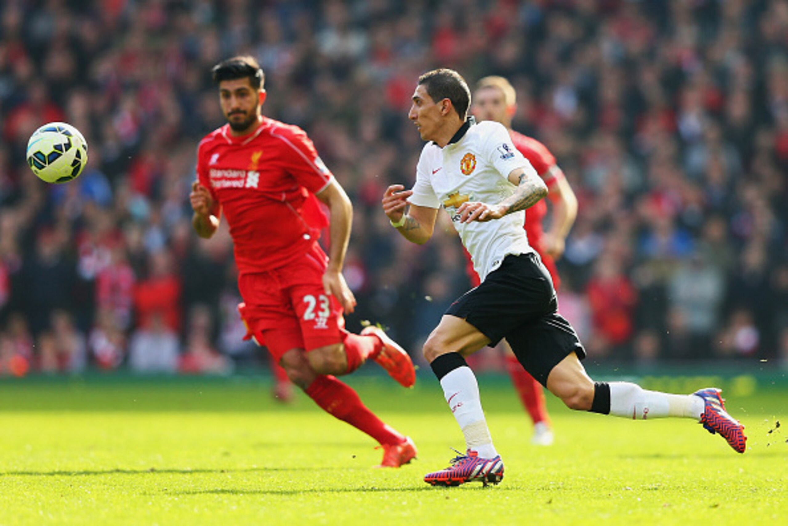 LIVERPOOL, ENGLAND - MARCH 22:  Angel Di Maria of Manchester United challenges for the ball with Emre Can of Liverpool during the Barclays Premier League match between Liverpool and Manchester United at Anfield on March 22, 2015 in Liverpool, England.  (P