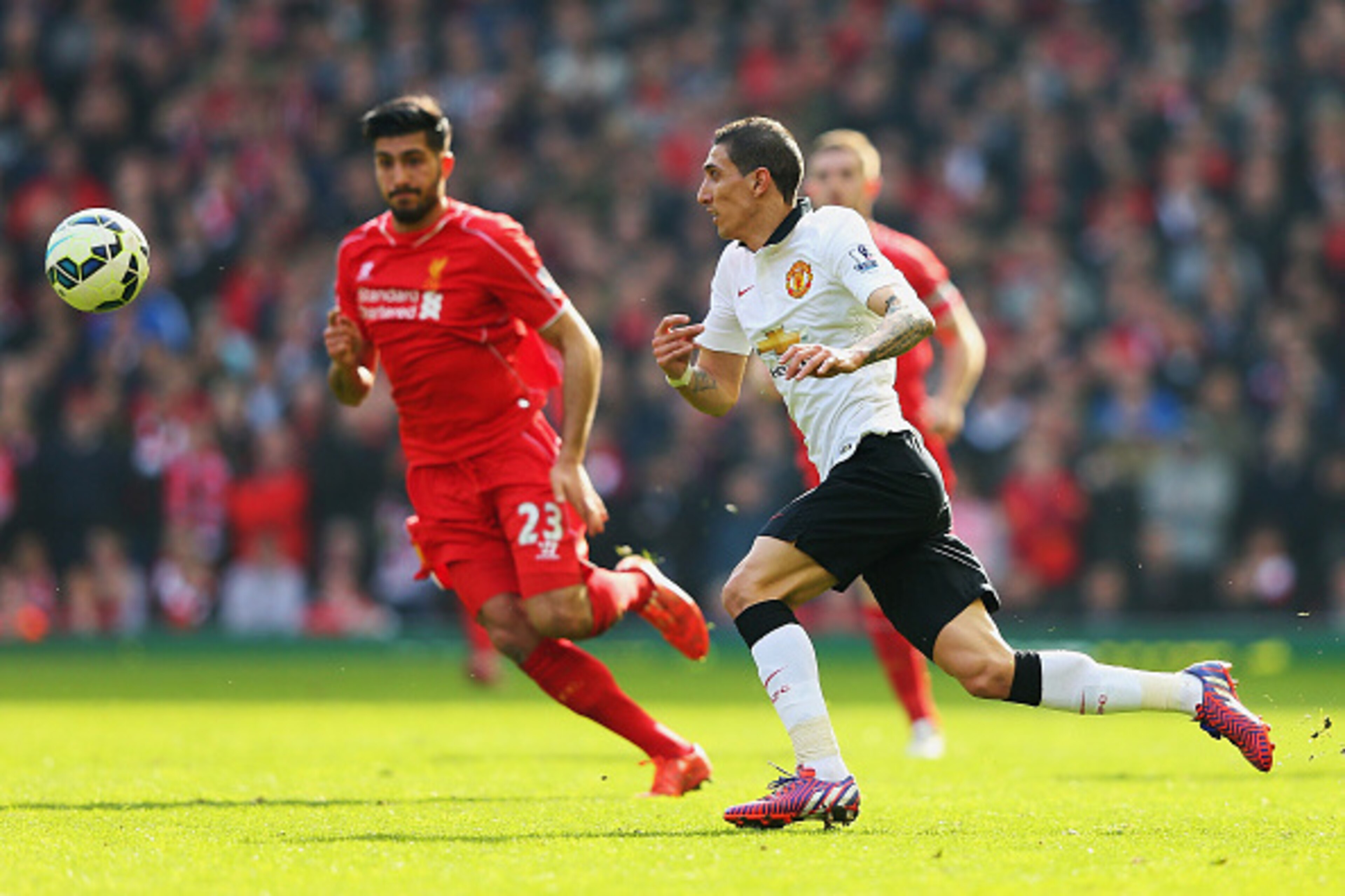 LIVERPOOL, ENGLAND - MARCH 22:  Angel Di Maria of Manchester United challenges for the ball with Emre Can of Liverpool during the Barclays Premier League match between Liverpool and Manchester United at Anfield on March 22, 2015 in Liverpool, England.  (P