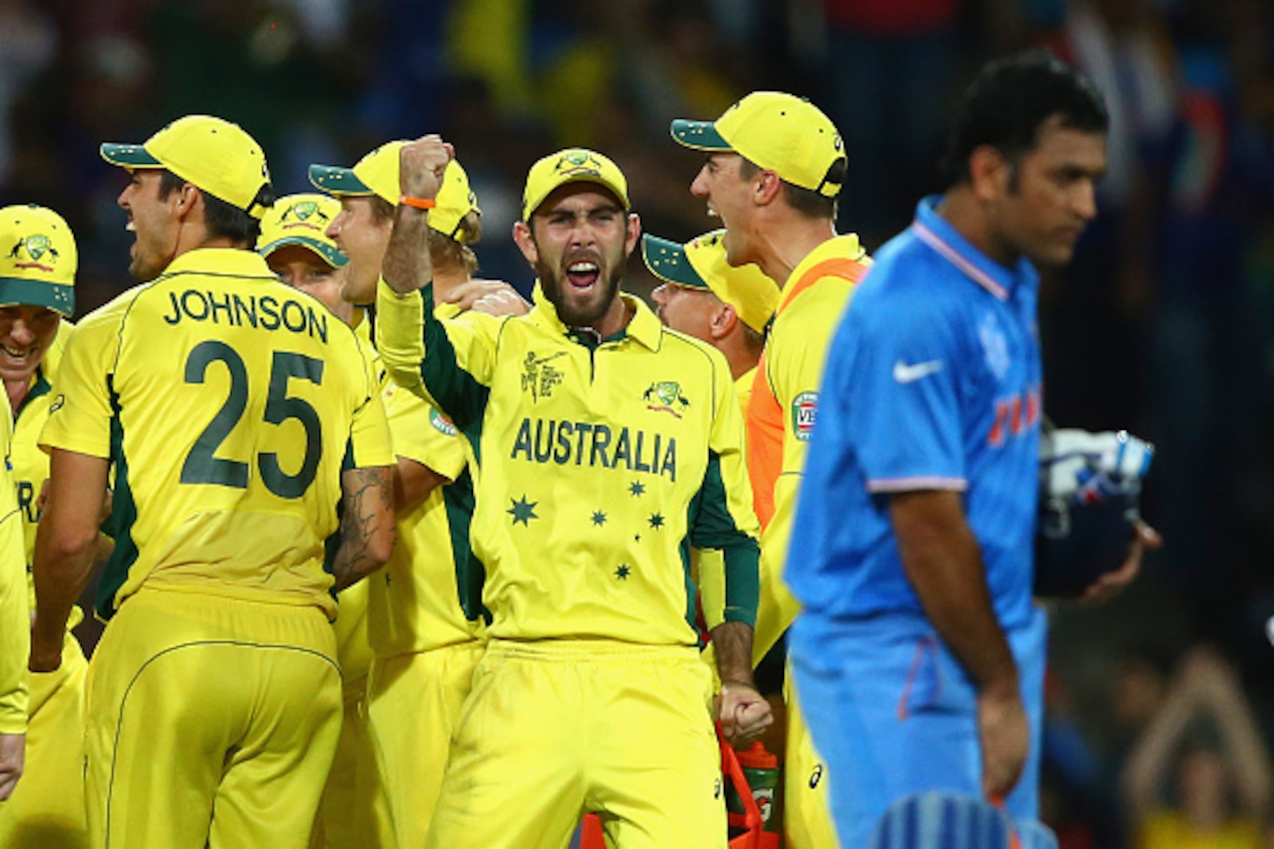 SYDNEY, AUSTRALIA - MARCH 26:  Glenn Maxwell of Australia celebrates after Mitchell Starc of Australia  took the wicket of Ajinkya Rahane of India during the 2015 Cricket World Cup Semi Final match between Australia and India at Sydney Cricket Ground on M