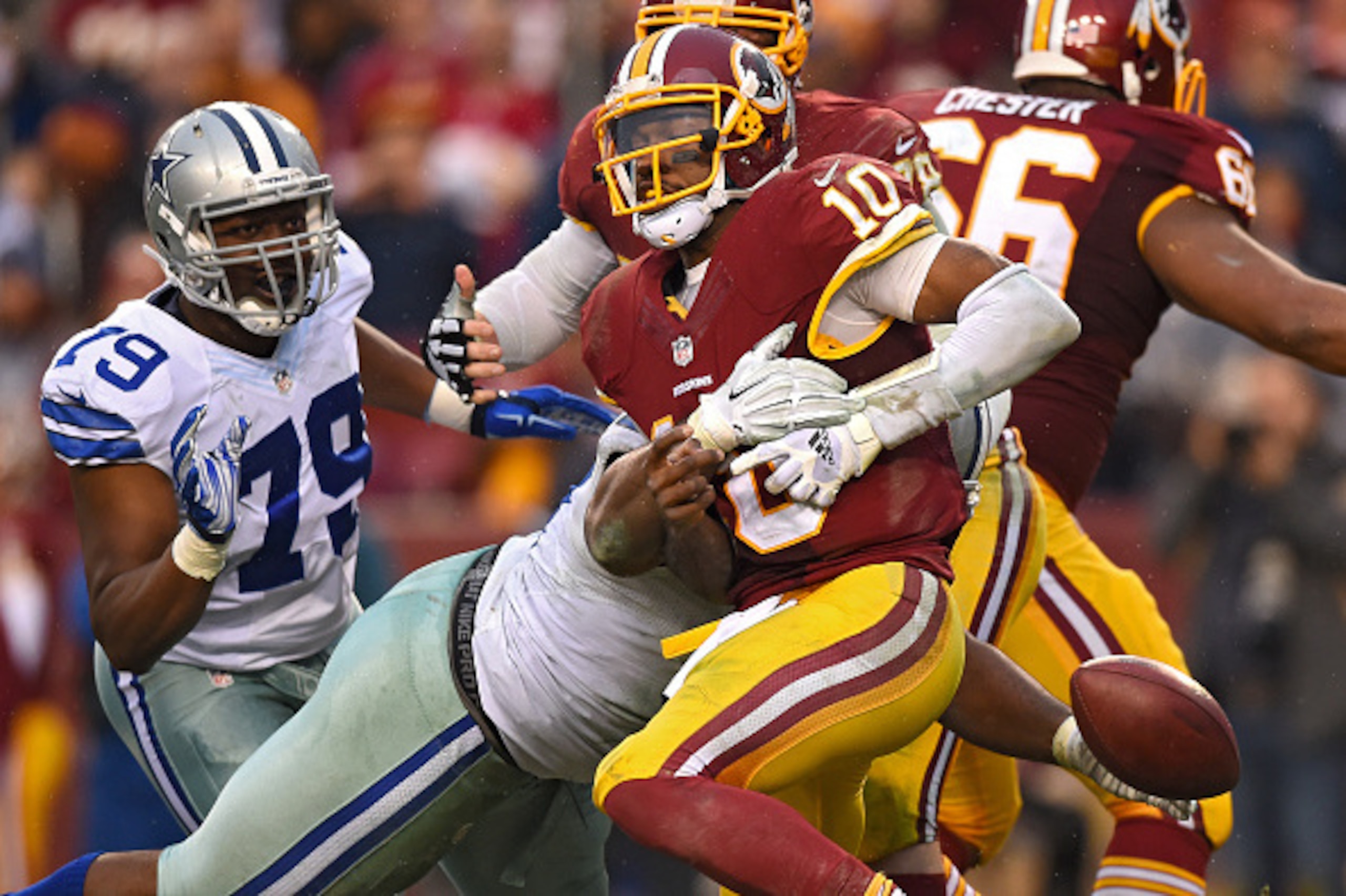 LANDOVER, MD - DECEMBER 28: Quarterback Robert Griffin III #10 of the Washington Redskins fumbles the ball as he is sacked by defensive tackle Terrell McClain #97 of the Dallas Cowboys in the fourth quarter at FedExField on December 28, 2014 in Landover, LANDOVER, MD - DECEMBER 28: Quarterback Robert Griffin III #10 of the Washington Redskins fumbles the ball as he is sacked by defensive tackle Terrell McClain #97 of the Dallas Cowboys in the fourth quarter at FedExField on December 28, 2014 in Landover,