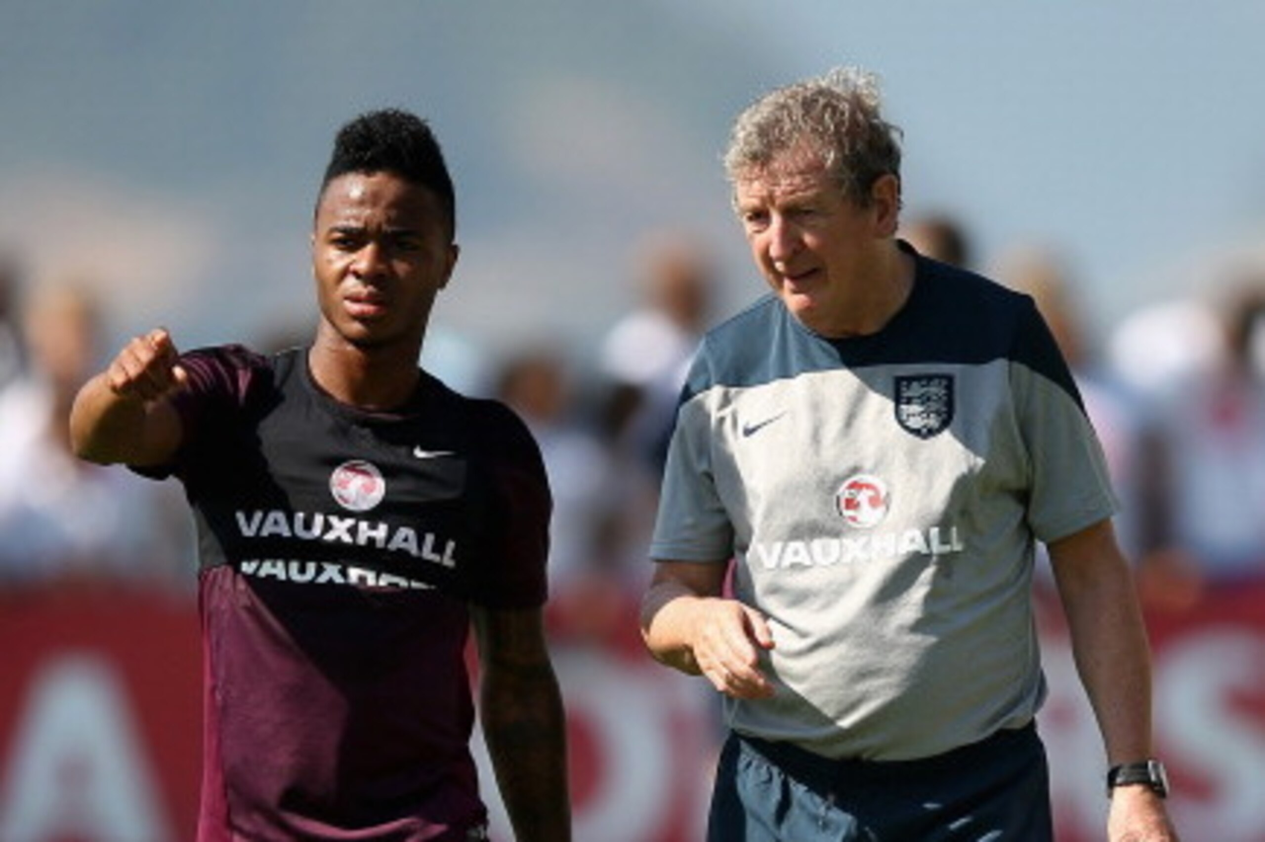 RIO DE JANEIRO, BRAZIL - JUNE 09:  Roy Hodgson, manager of England (R) talks with Raheem Sterling of England during a training session at the Urca military base (Forte de Urca) training ground on June 9, 2014 in Rio de Janeiro, Brazil.  (Photo by Richard 