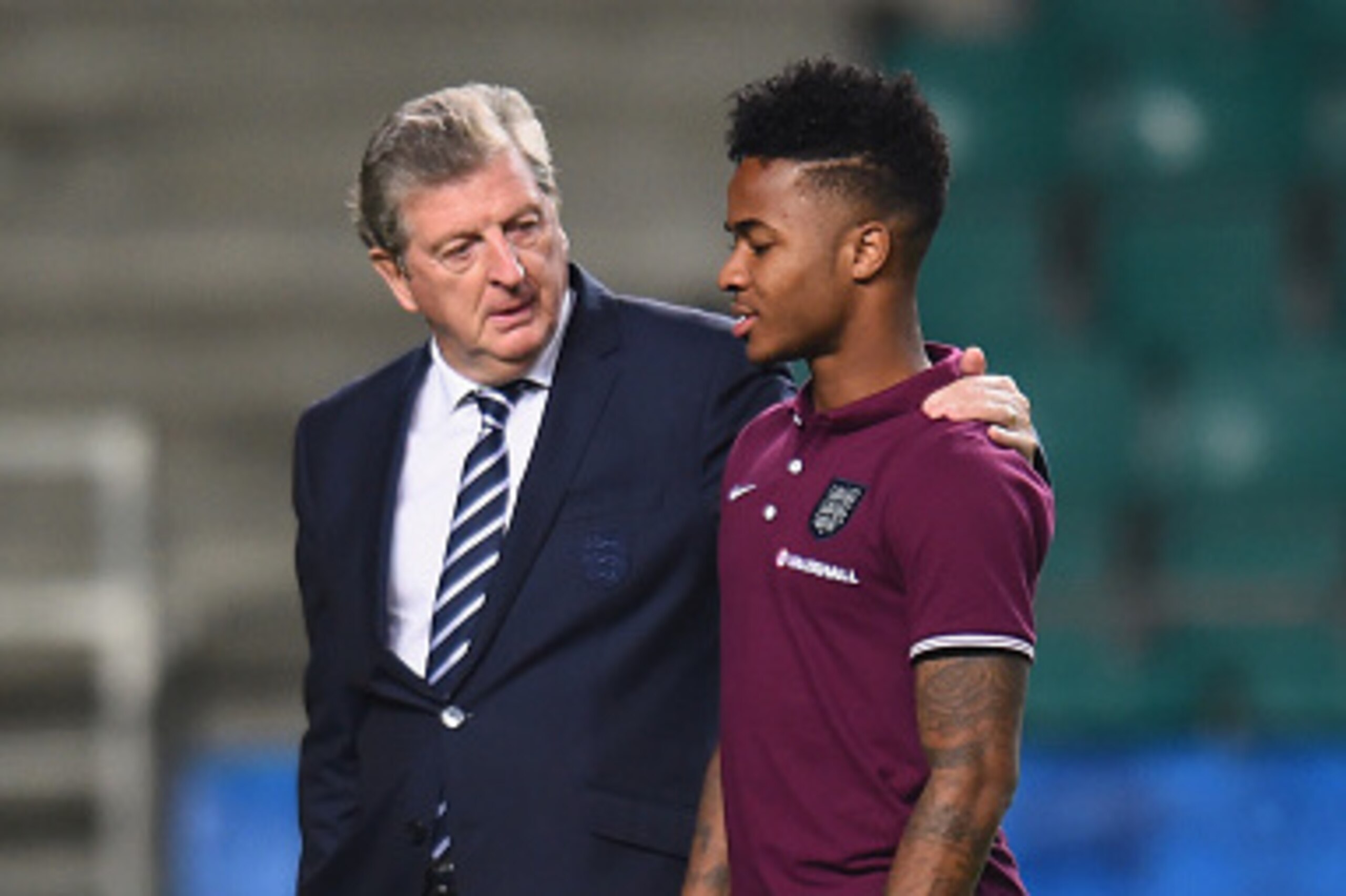 TALLINN, ESTONIA - OCTOBER 11:  England manager Roy Hodgson talks with Raheem Sterling during a stadium walk at A Le Coq Arena on October 11, 2014 in Tallinn, Estonia.  (Photo by Shaun Botterill/Getty Images)