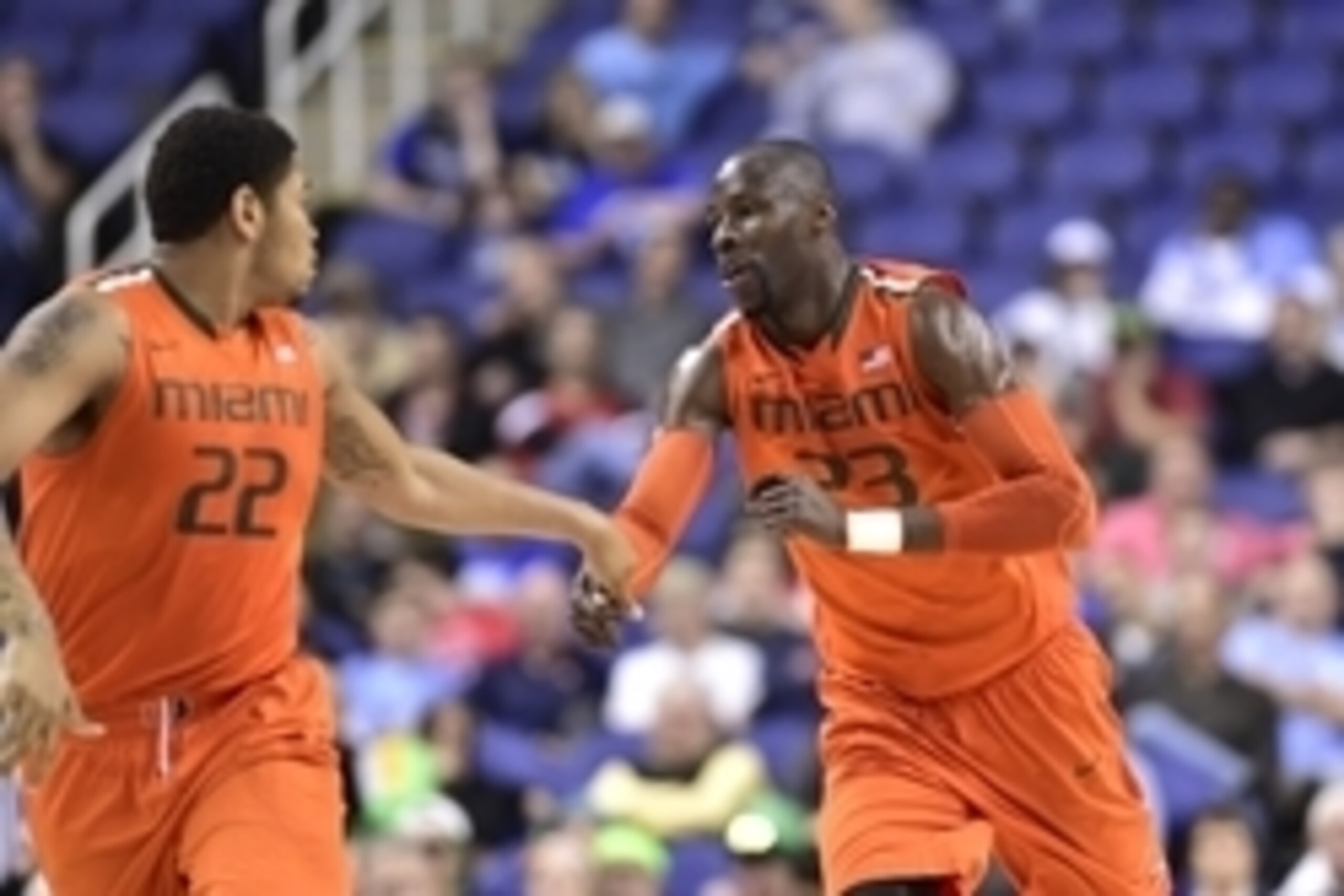 Mar 12, 2015; Greensboro, NC, USA; Miami (Fl) Hurricanes forward Omar Sherman (22) and center Tonye Jekiri (23) react in the first half in the quarter finals of the ACC Tournament at Greensboro Coliseum. Mandatory Credit: Bob Donnan-USA TODAY Sports