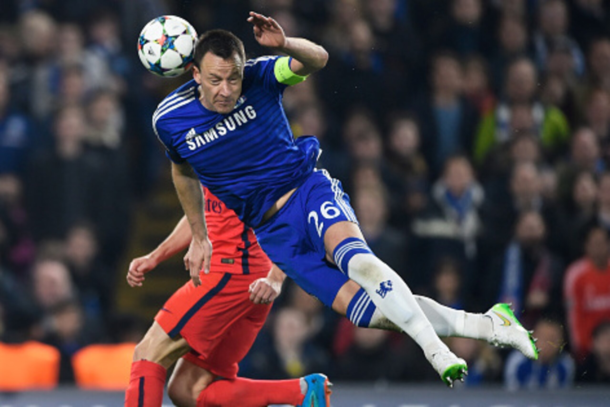 LONDON, ENGLAND - MARCH 11: John Terry of Chelsea heads the ball clear during the UEFA Champions League Round of 16, second leg match between Chelsea and Paris Saint-Germain at Stamford Bridge on March 11, 2015 in London, England. (Photo by Mike Hewitt/ LONDON, ENGLAND - MARCH 11: John Terry of Chelsea heads the ball clear during the UEFA Champions League Round of 16, second leg match between Chelsea and Paris Saint-Germain at Stamford Bridge on March 11, 2015 in London, England. (Photo by Mike Hewitt/