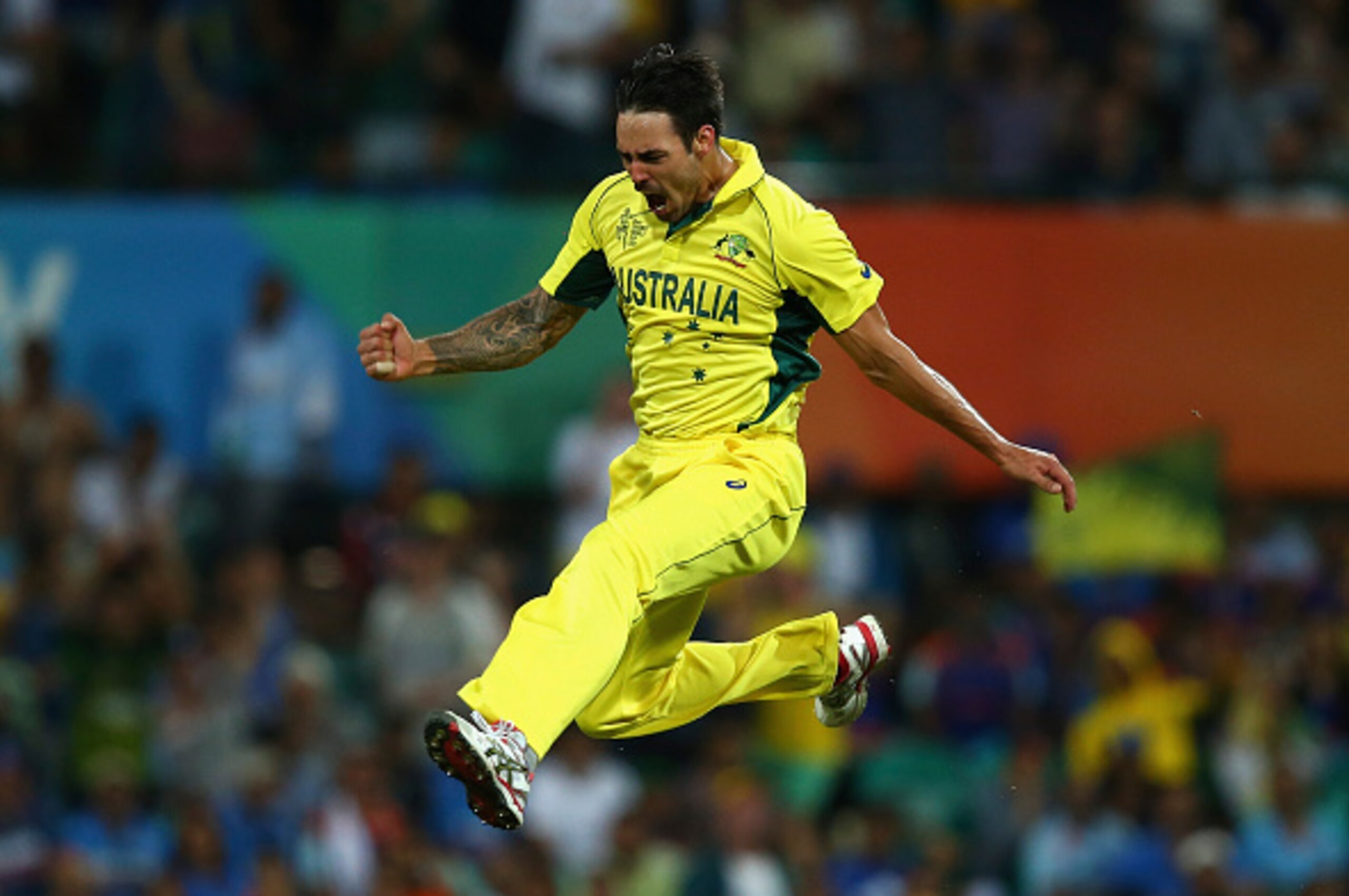 SYDNEY, AUSTRALIA - MARCH 26:  Mitchell Johnson of Australia celebrates after taking the wicket of Rohit Sharma of India during the 2015 Cricket World Cup Semi Final match between Australia and India at Sydney Cricket Ground on March 26, 2015 in Sydney, A