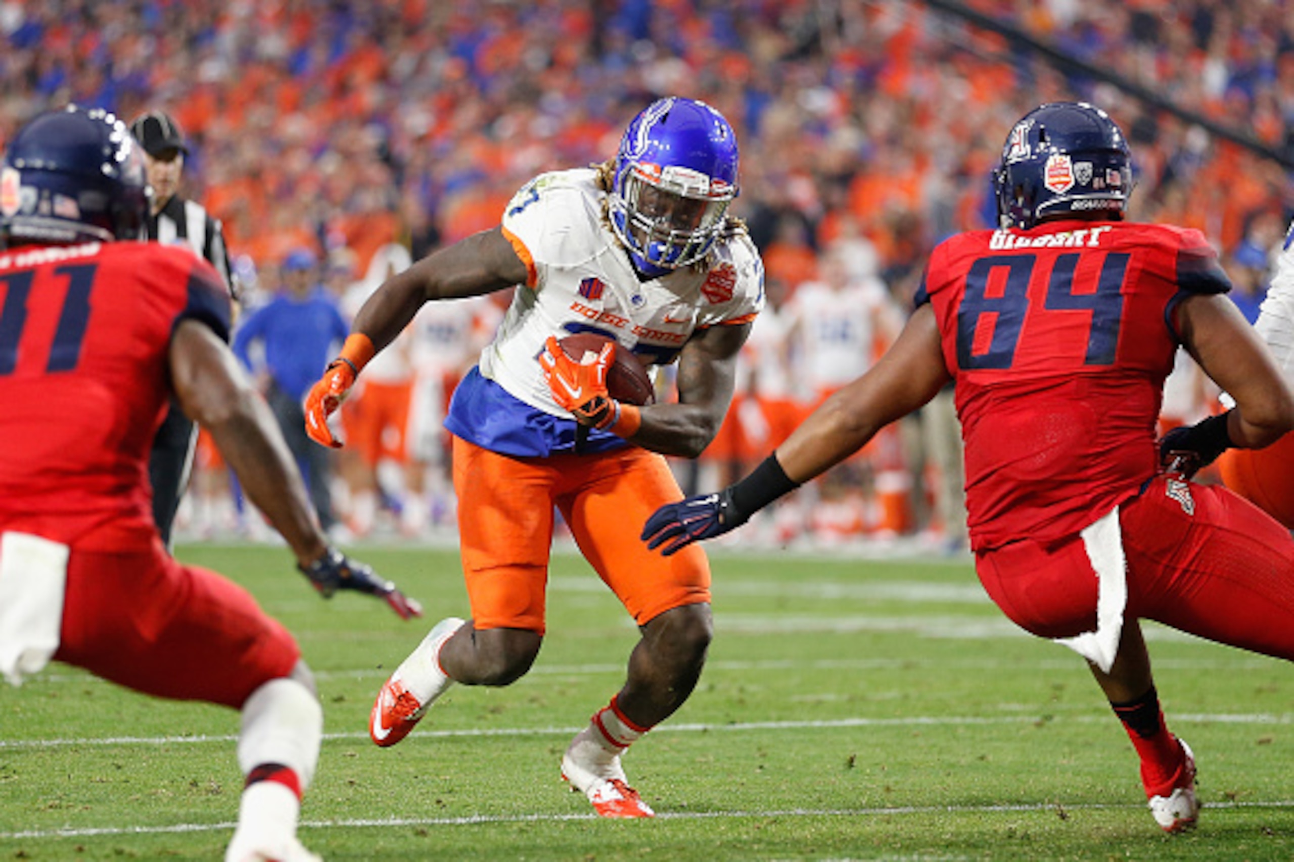 GLENDALE, AZ - DECEMBER 31:  Running back Jay Ajayi #27 of the Boise State Broncos rushes the football against the Arizona Wildcats during the Vizio Fiesta Bowl at University of Phoenix Stadium on December 31, 2014 in Glendale, Arizona.  (Photo by Christi