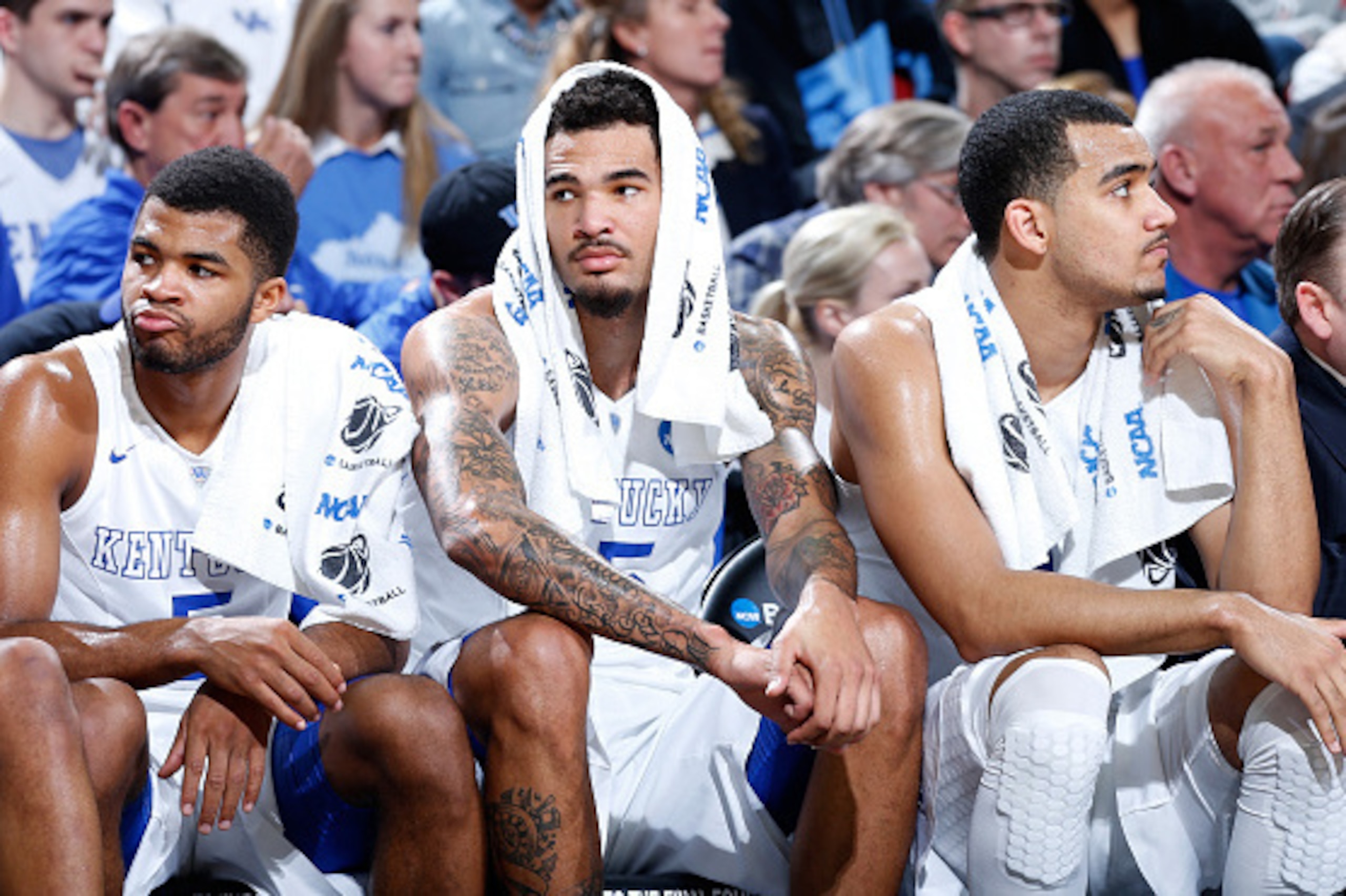 LOUISVILLE, KY - MARCH 21:  (L-R)Teammates Andrew Harrison #5, Willie Cauley-Stein #15 and Trey Lyles #41 of the Kentucky Wildcats sit on the bench against the Cincinnati Bearcats during the third round of the 2015 NCAA Men's Basketball Tournament at KFC 
