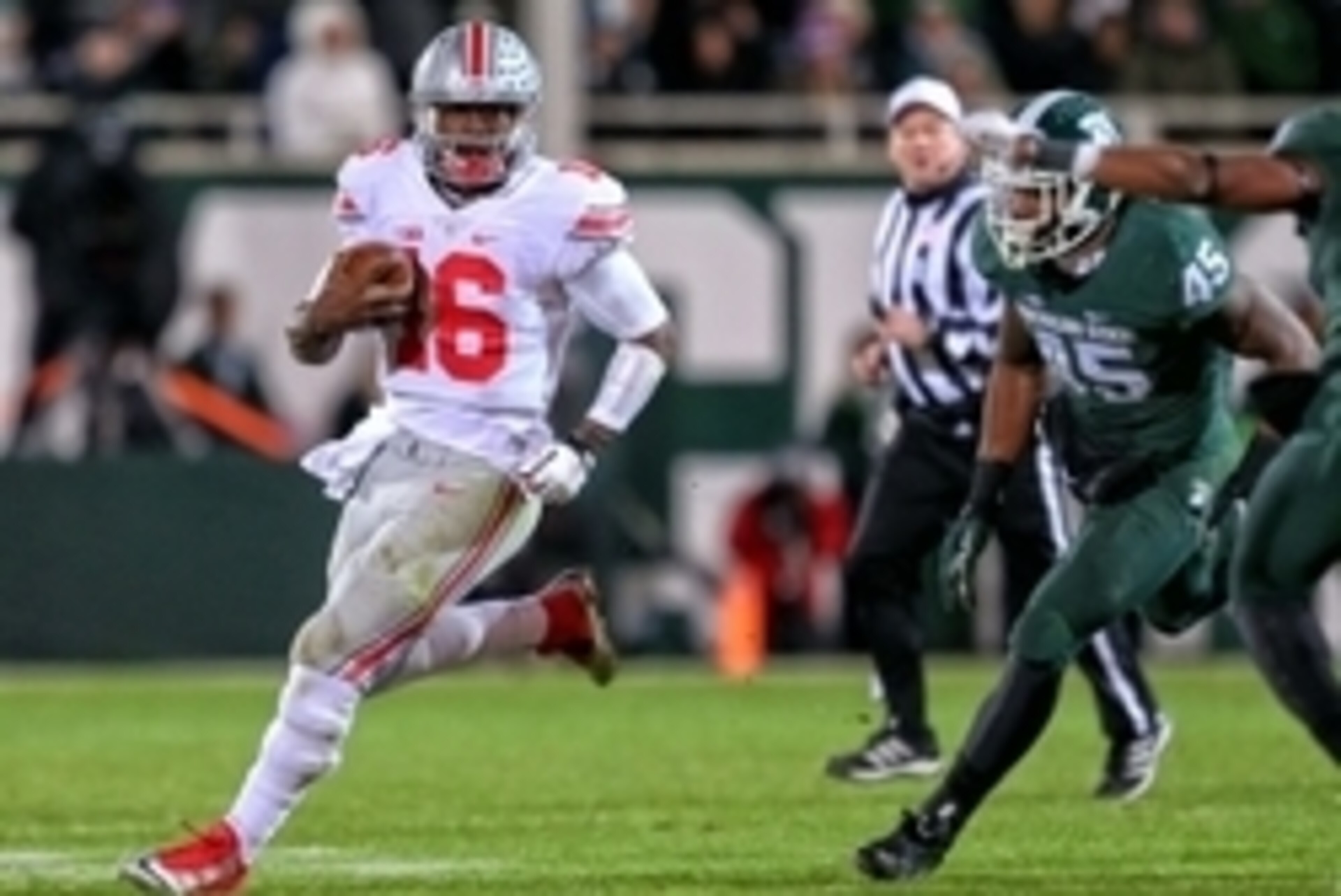 Nov 8, 2014; East Lansing, MI, USA; Ohio State Buckeyes quarterback J.T. Barrett (16) gets outside of Michigan State Spartans linebacker Darien Harris (45) during the 2nd half of a game at Spartan Stadium. Mandatory Credit: Mike Carter-USA TODAY Sports Nov 8, 2014; East Lansing, MI, USA; Ohio State Buckeyes quarterback J.T. Barrett (16) gets outside of Michigan State Spartans linebacker Darien Harris (45) during the 2nd half of a game at Spartan Stadium. Mandatory Credit: Mike Carter-USA TODAY Sports