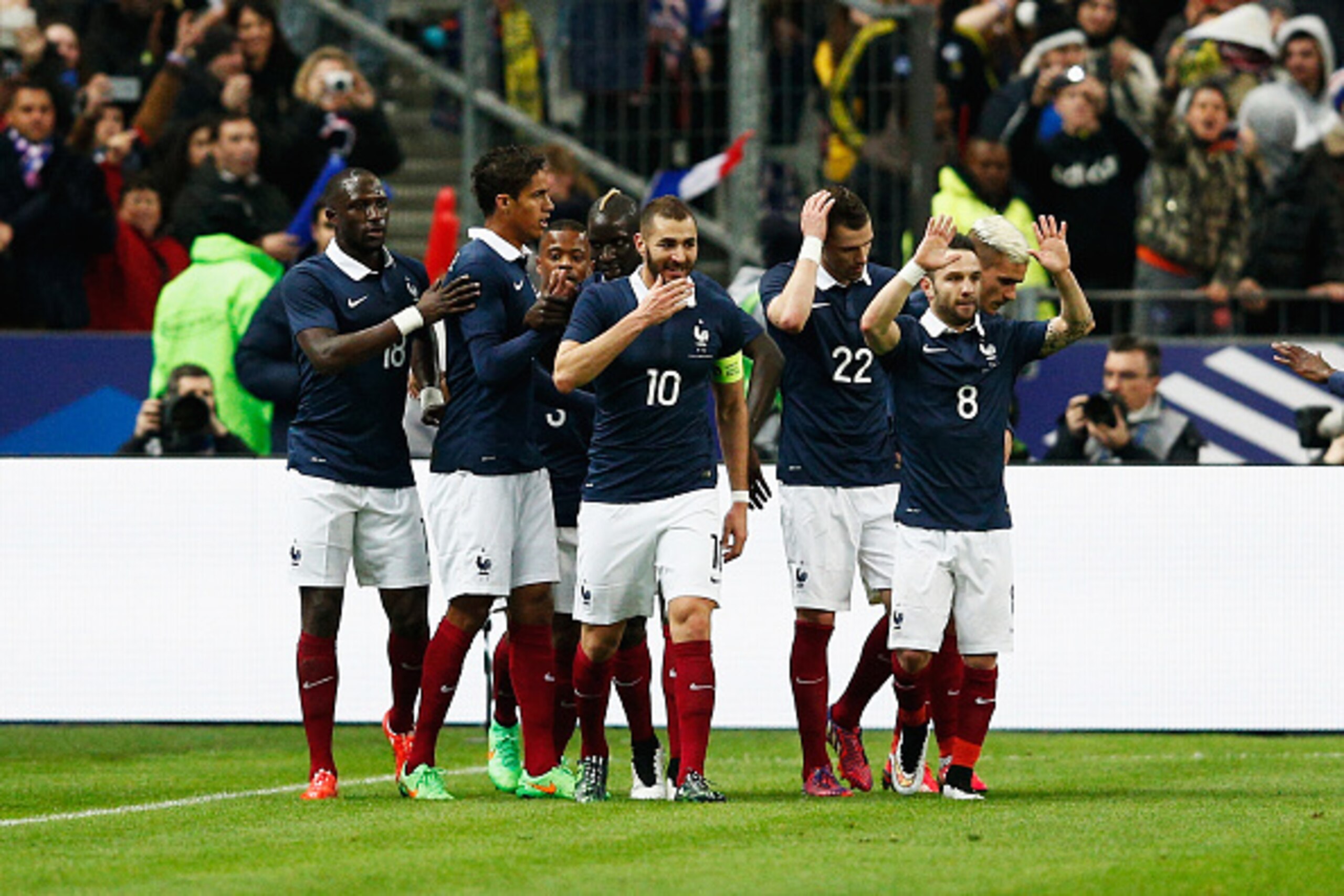 PARIS, FRANCE - MARCH 26:  Raphael Varane #4 of France celebrates with team mates after scoring the first goal of the game during the International Friendly match between France and Brazil at the Stade de France on March 26, 2015 in Paris, France.  (Photo