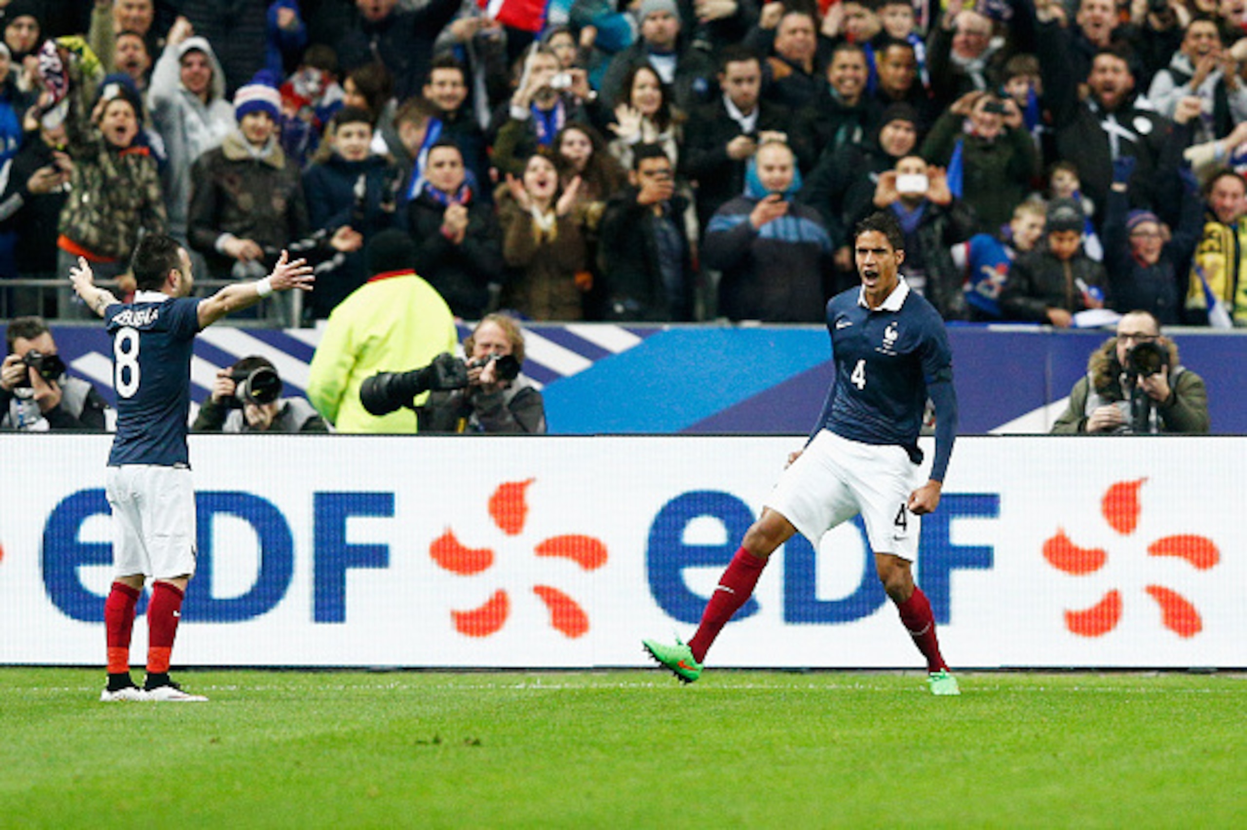 PARIS, FRANCE - MARCH 26:  Raphael Varane #4 of France celebrates with team mates after scoring the first goal of the game during the International Friendly match between France and Brazil at the Stade de France on March 26, 2015 in Paris, France.  (Photo