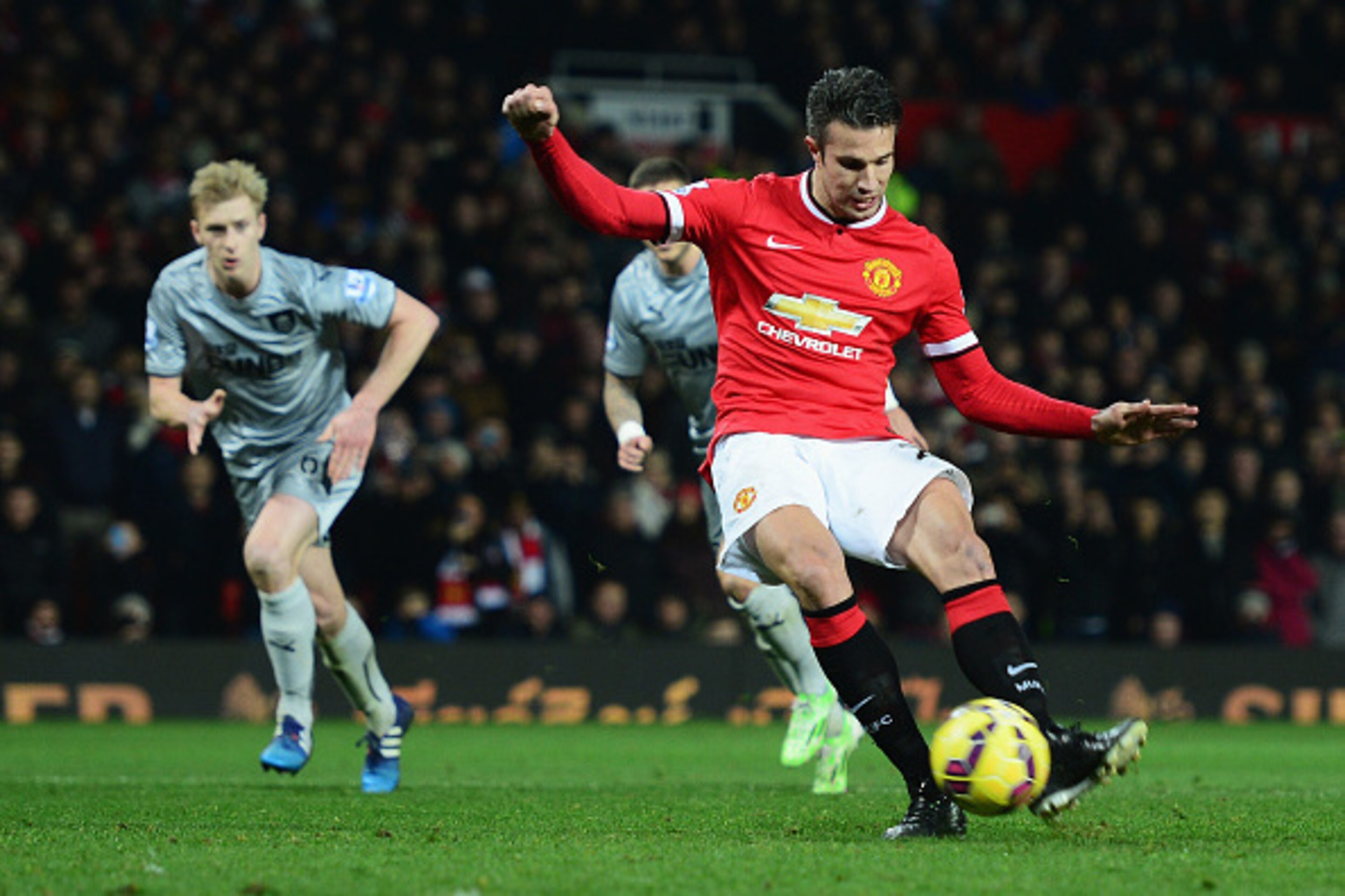 MANCHESTER, ENGLAND - FEBRUARY 11:  Robin van Persie of Manchester United scores from the penalty spot during the Barclays Premier League match between Manchester United and Burnley at Old Trafford on February 11, 2015 in Manchester, England.  (Photo by J