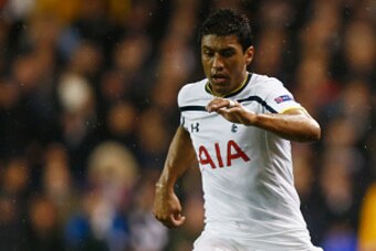 LONDON, ENGLAND - FEBRUARY 19:  Stefan Savic of Fiorentina clears the ball from Paulinho of Spurs during the UEFA Europa League Round of 32 first leg match between Tottenham Hotspur FC and ACF Fiorentina at White Hart Lane on February 19, 2015 in London,