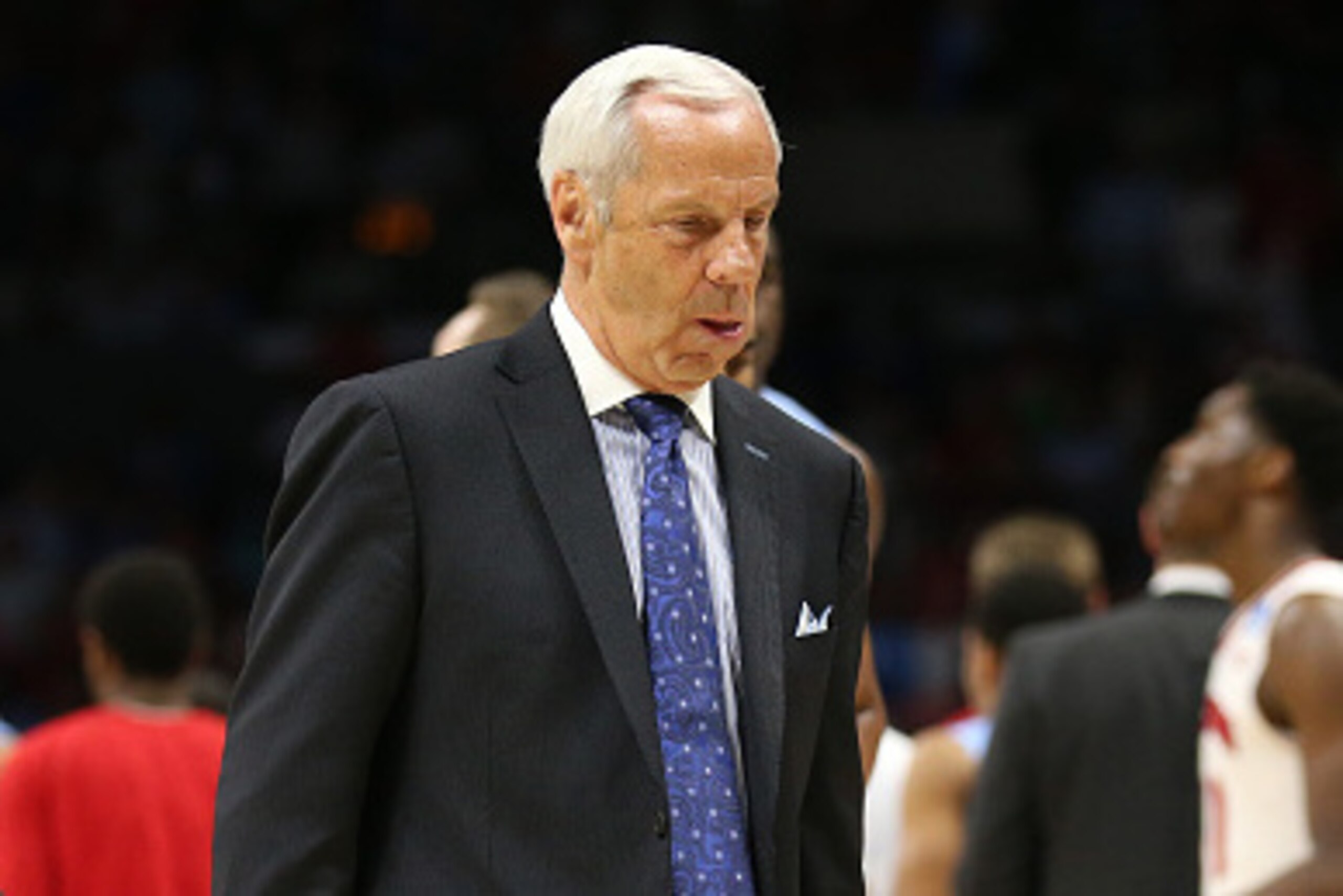 LOS ANGELES, CA - MARCH 26:  Head coach Roy Williams of the North Carolina Tar Heels walks off the court after losing 79-72 to the Wisconsin Badgers during the West Regional Semifinal of the 2015 NCAA Men's Basketball Tournament at Staples Center on March
