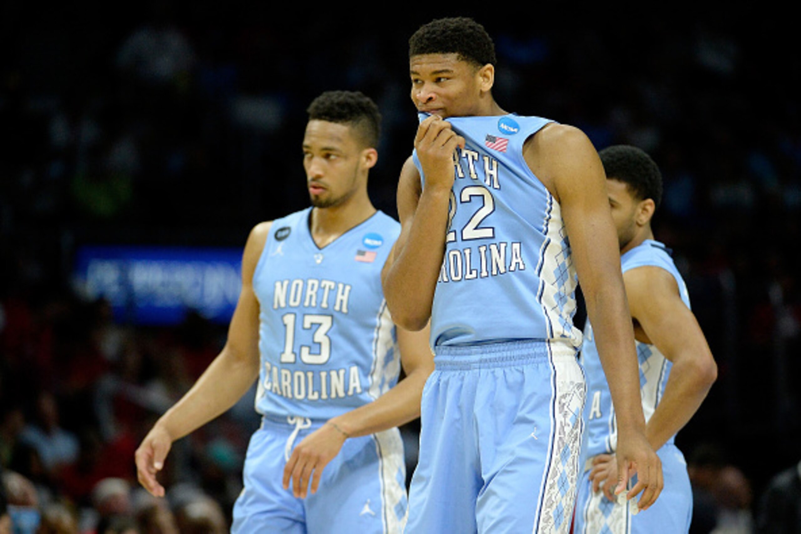LOS ANGELES, CA - MARCH 26:  Isaiah Hicks #22 and J.P. Tokoto #13 of the North Carolina Tar Heels react in the second half while taking on the Wisconsin Badgers during the West Regional Semifinal of the 2015 NCAA Men's Basketball Tournament at Staples Cen