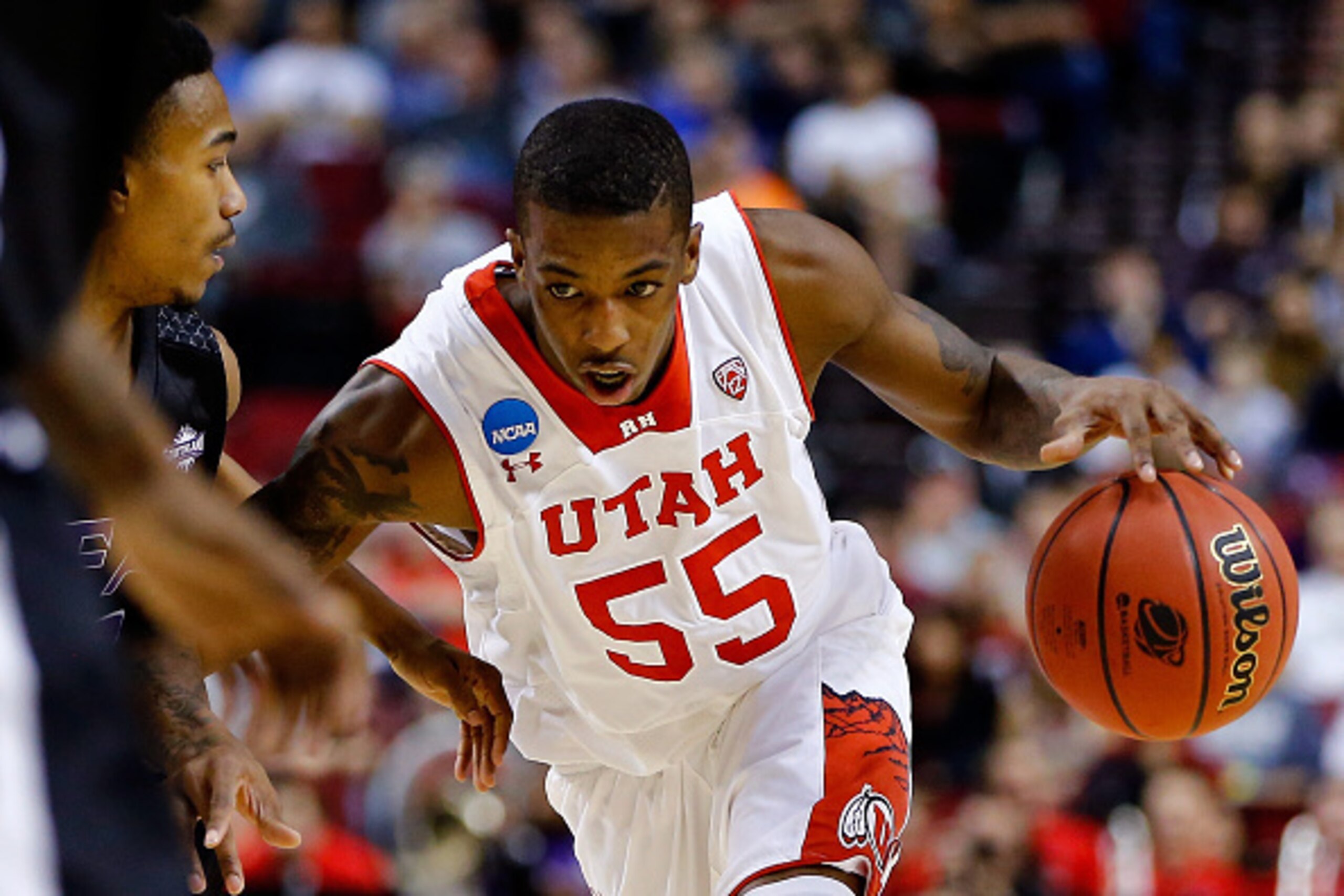 PORTLAND, OR - MARCH 19: Delon Wright #55 of the Utah Utes controls the ball in the first half against the Stephen F. Austin Lumberjacks during the second round of the 2015 NCAA Men's Basketball Tournament at Moda Center on March 19, 2015 in Portland, Ore