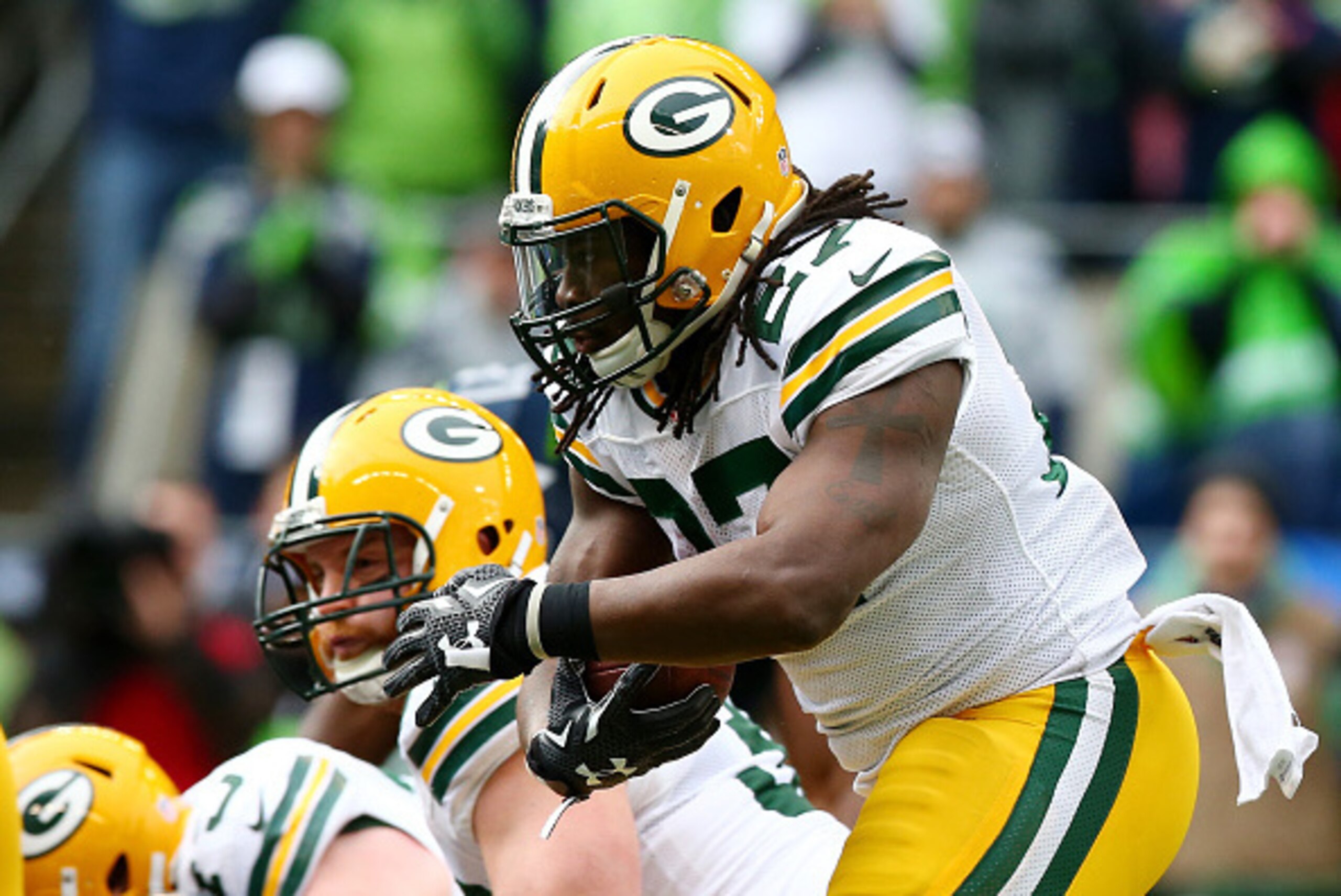SEATTLE, WA - JANUARY 18:  Eddie Lacy #27 of the Green Bay Packers carries the ball against the Seattle Seahawks during the 2015 NFC Championship game at CenturyLink Field on January 18, 2015 in Seattle, Washington.  (Photo by Ronald Martinez/Getty Images