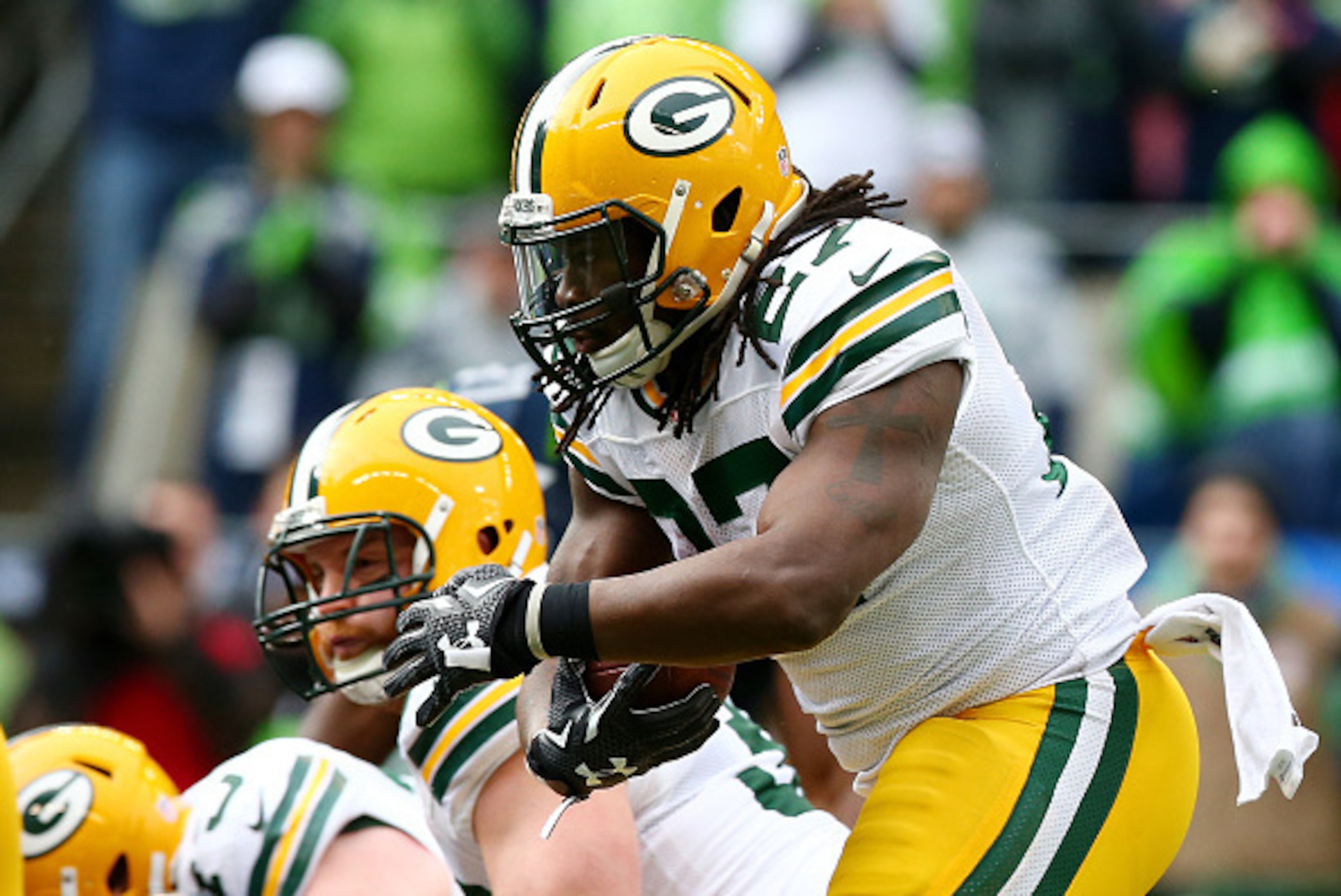 SEATTLE, WA - JANUARY 18:  Eddie Lacy #27 of the Green Bay Packers carries the ball against the Seattle Seahawks during the 2015 NFC Championship game at CenturyLink Field on January 18, 2015 in Seattle, Washington.  (Photo by Ronald Martinez/Getty Images