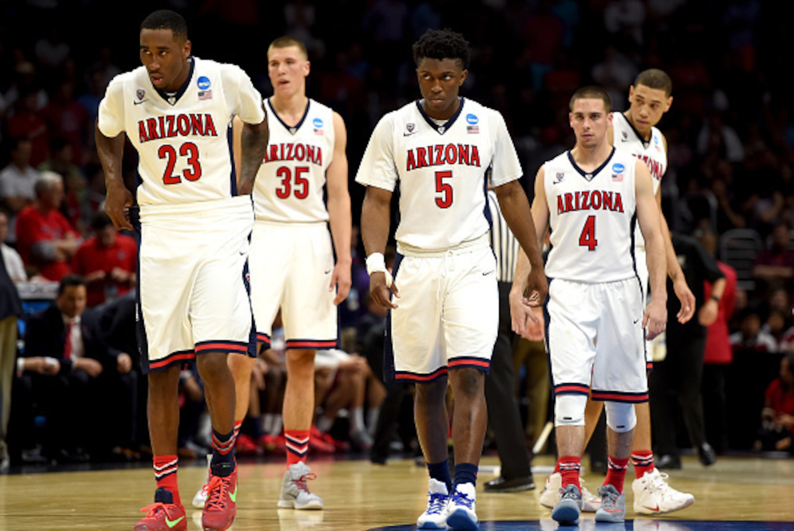 LOS ANGELES, CA - MARCH 26:  Rondae Hollis-Jefferson #23, Kaleb Tarczewski #35, Stanley Johnson #5, T.J. McConnell #4 and Brandon Ashley #21 of the Arizona Wildcats walk back to the court against the Xavier Musketeers during the West Regional Semifinal of