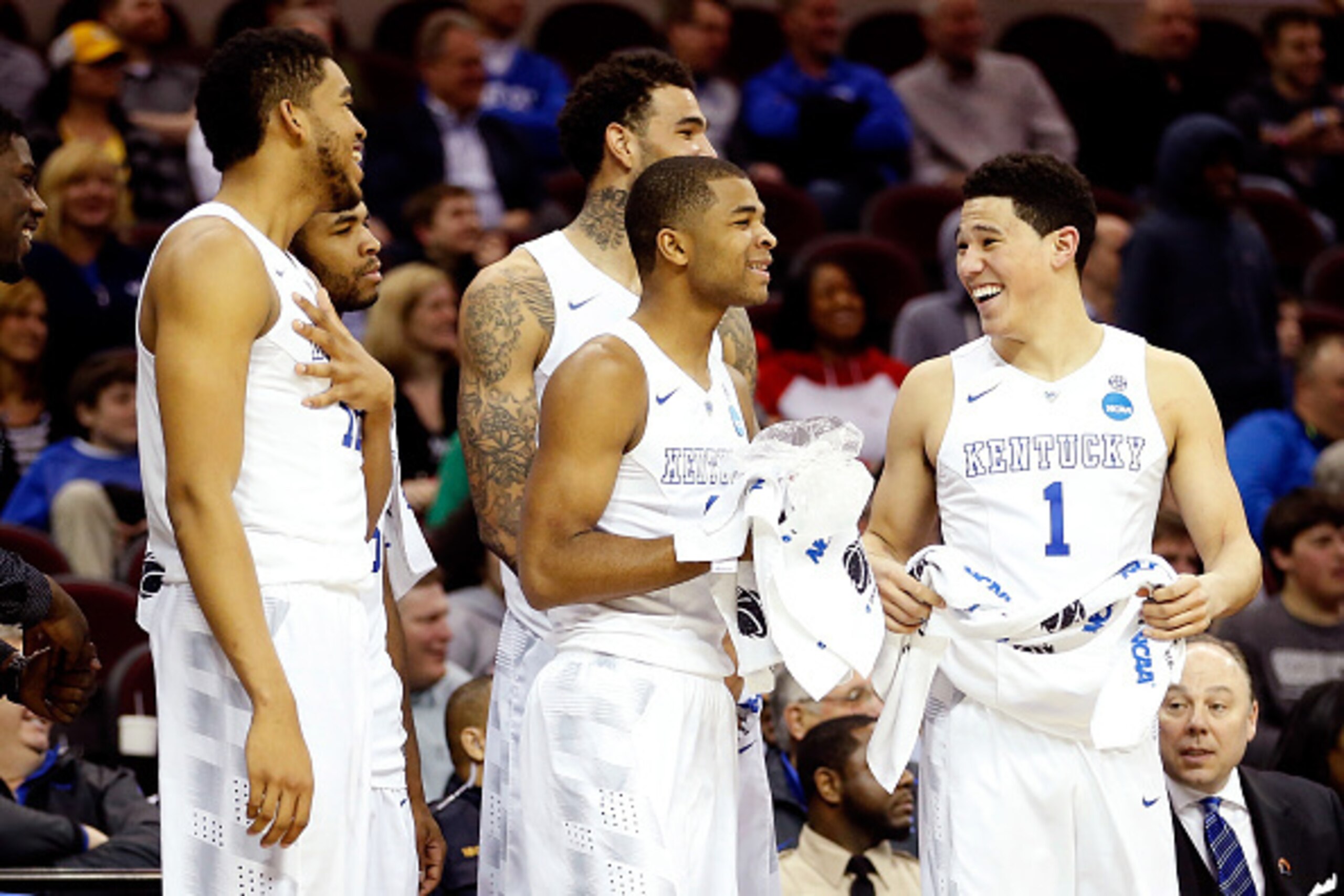 CLEVELAND, OH - MARCH 26: Karl-Anthony Towns #12, Andrew Harrison #5, Willie Cauley-Stein #15, Aaron Harrison #2 and Devin Booker #1 of the Kentucky Wildcats react late in the game from the bench against the West Virginia Mountaineers during the Midwest R CLEVELAND, OH - MARCH 26: Karl-Anthony Towns #12, Andrew Harrison #5, Willie Cauley-Stein #15, Aaron Harrison #2 and Devin Booker #1 of the Kentucky Wildcats react late in the game from the bench against the West Virginia Mountaineers during the Midwest R