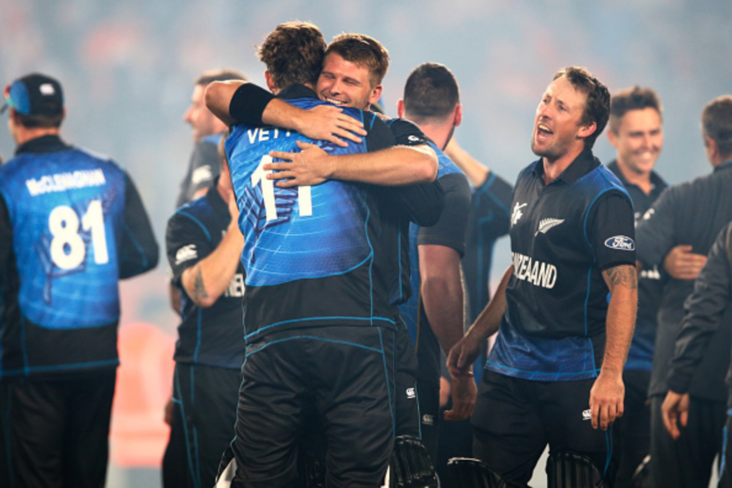 AUCKLAND, NEW ZEALAND - MARCH 24: Corey Anderson of New Zealand hugs Daniel Vettori following the 2015 Cricket World Cup Semi Final match between New Zealand and South Africa at Eden Park on March 24, 2015 in Auckland, New Zealand.  (Photo by Phil Walter/