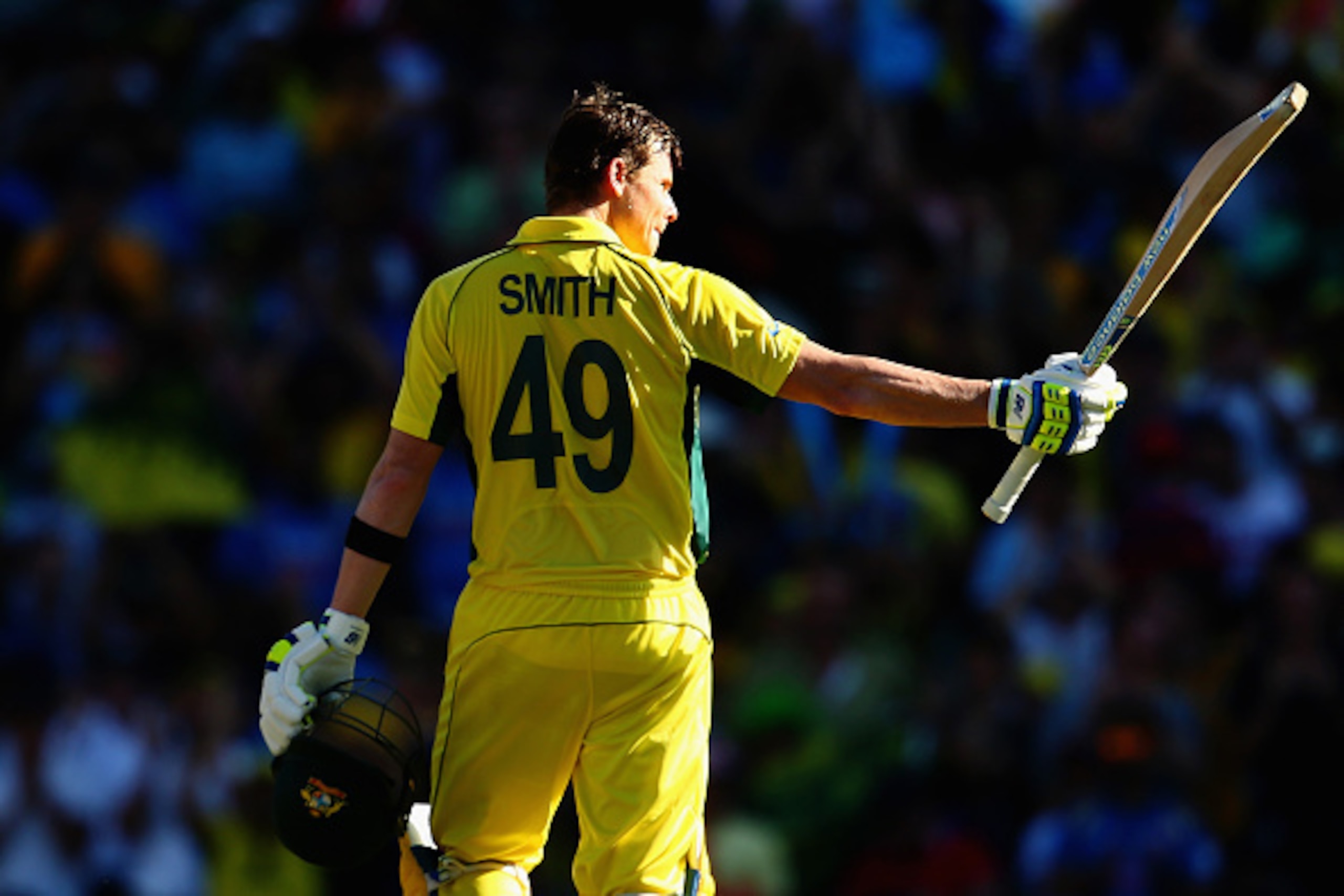 SYDNEY, AUSTRALIA - MARCH 26:  Steve Smith of Australia celebrates after reaching his century during the 2015 Cricket World Cup Semi Final match between Australia and India at Sydney Cricket Ground on March 26, 2015 in Sydney, Australia.  (Photo by Mark K