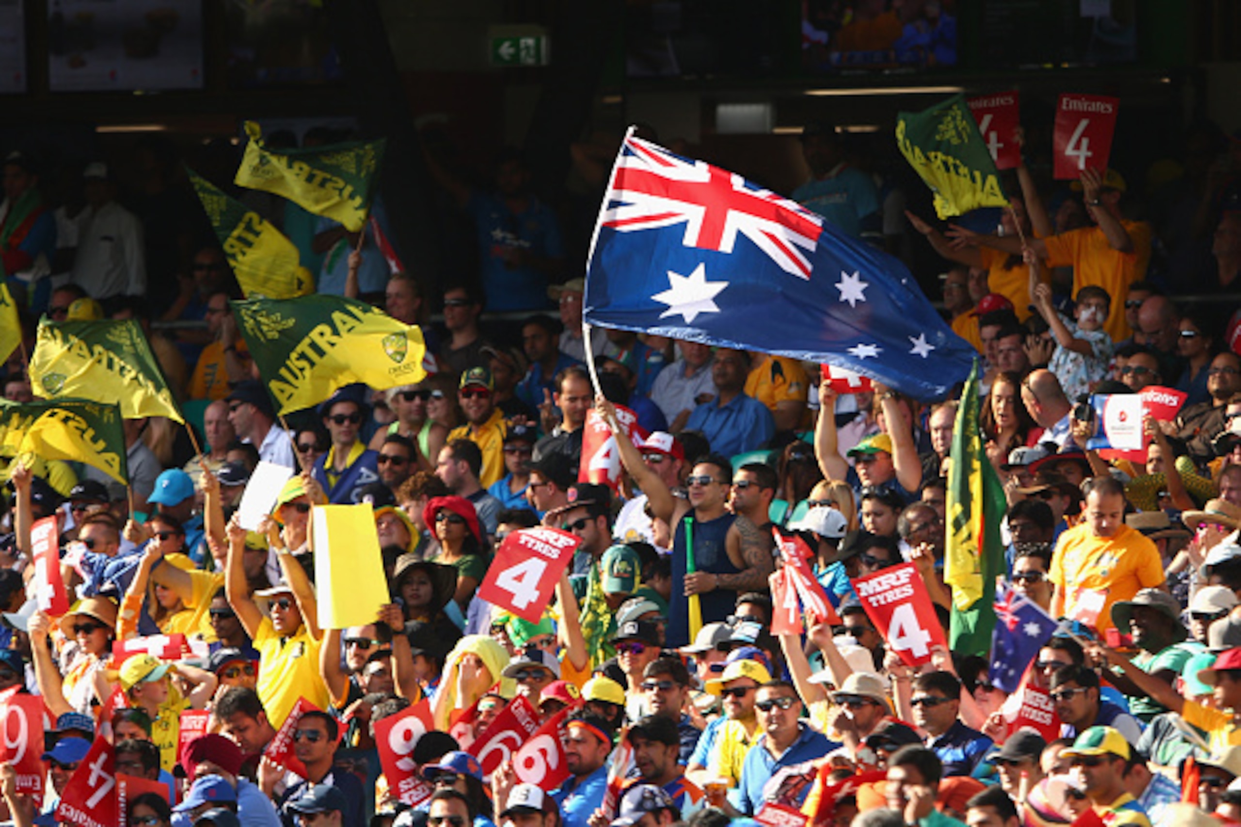 SYDNEY, AUSTRALIA - MARCH 26:  Australian fans celebrate a shot to the boundary during the 2015 Cricket World Cup Semi Final match between Australia and India at Sydney Cricket Ground on March 26, 2015 in Sydney, Australia.  (Photo by Cameron Spencer/Gett