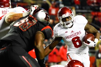 PISCATAWAY, NJ - NOVEMBER 15: Tevin Coleman #6 of the Indiana Hoosiers runs the ball in the fourth quarter during a game against the Rutgers Scarlet Knights at High Point Solutions Stadium on November 15, 2014 in Piscataway, New Jersey.  (Photo by Alex Go