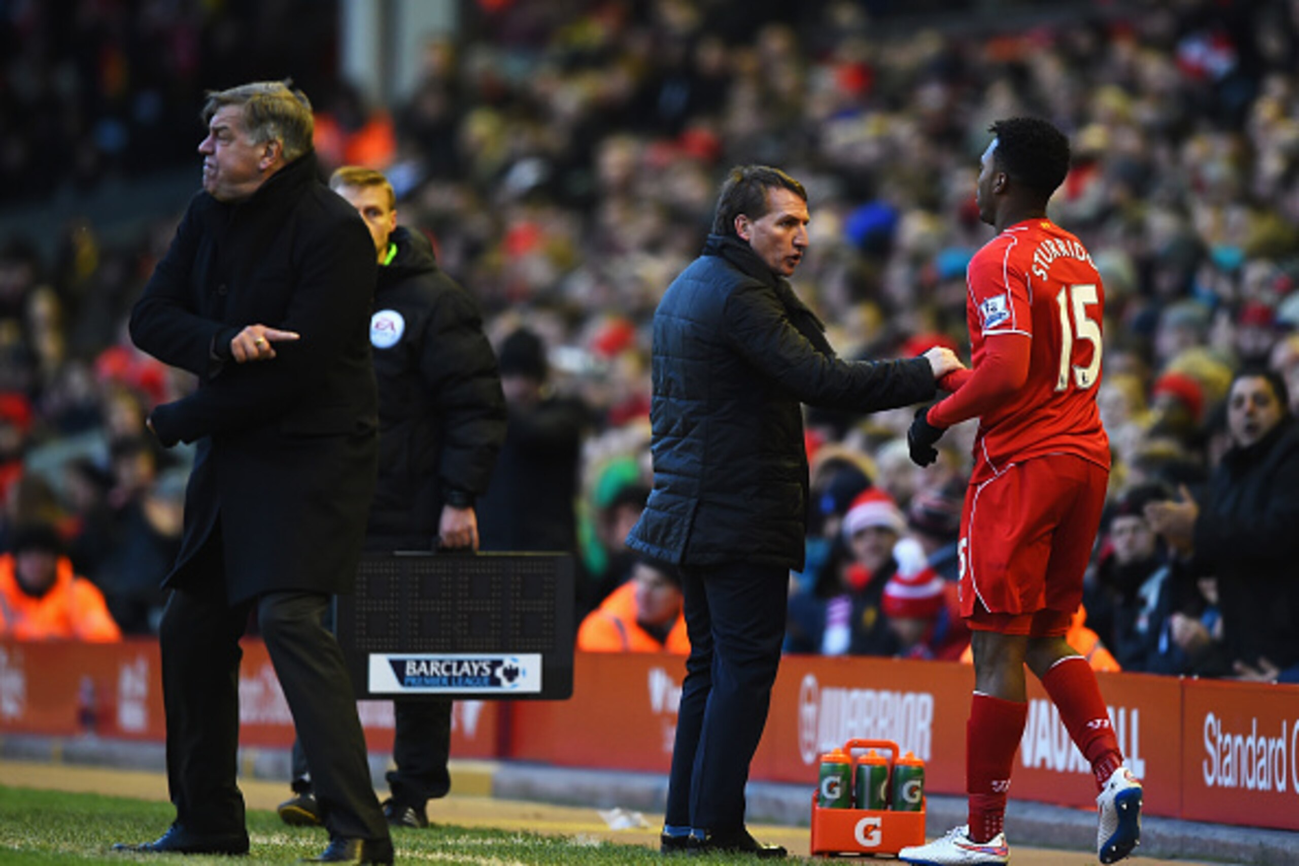 LIVERPOOL, ENGLAND - JANUARY 31:  Brendan Rodgers, manager of Liverpool prepares to bring on Daniel Sturridge as Sam Allardyce, manager of West Ham United reacts during the Barclays Premier League match between Liverpool and West Ham United at Anfield on 